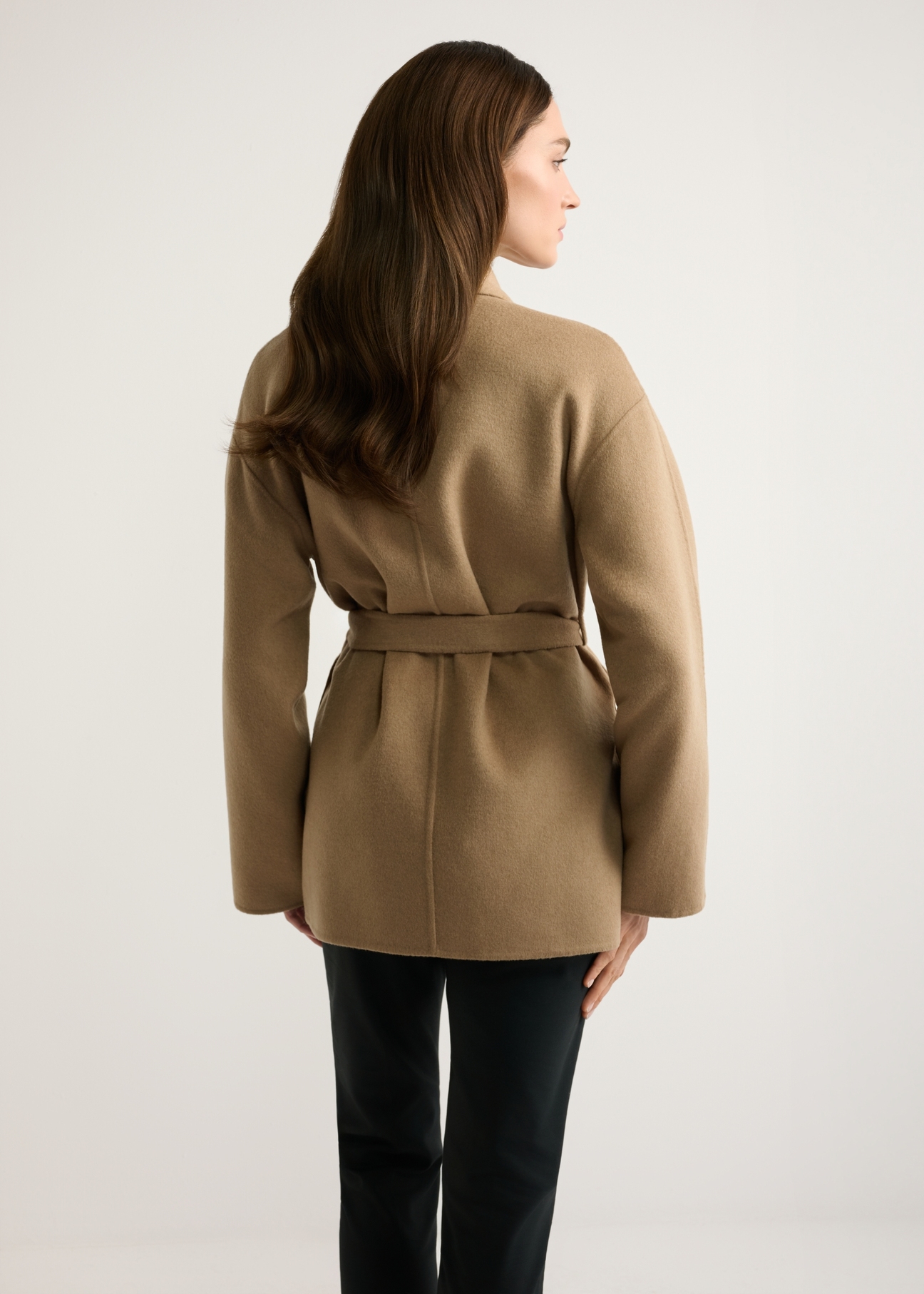Women's camel wool coat PLADT-0074-1D(W26), back view of the product on the model. Half of the silhouette visible.