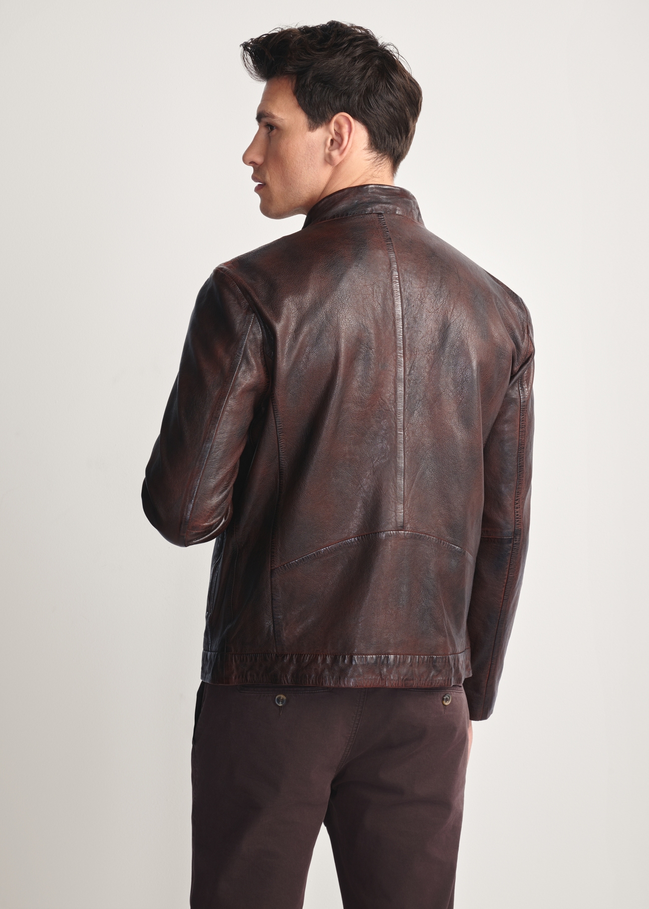 Brown men's leather jacket KURMS-0384-3340(Z25), product view from the back on the model, half of the silhouette visible.