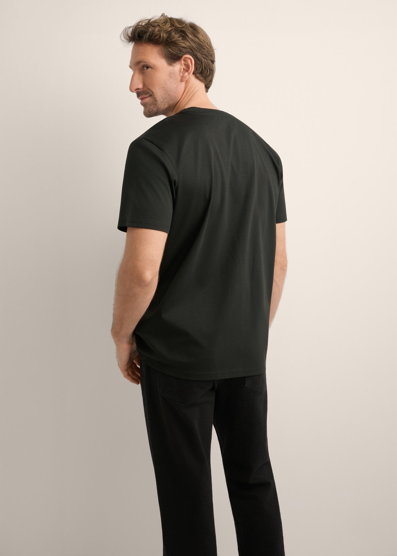 Men's black mercerized cotton T-shirt TSHMT-0156-99(Z26), back view of the product on the model. Half of the silhouette visible.