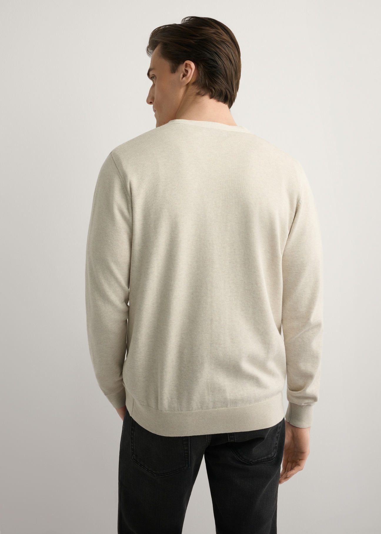 Men's light beige cotton cardigan KARMT-0003-1A(W26), back view of the product on the model. Half of the silhouette visible.