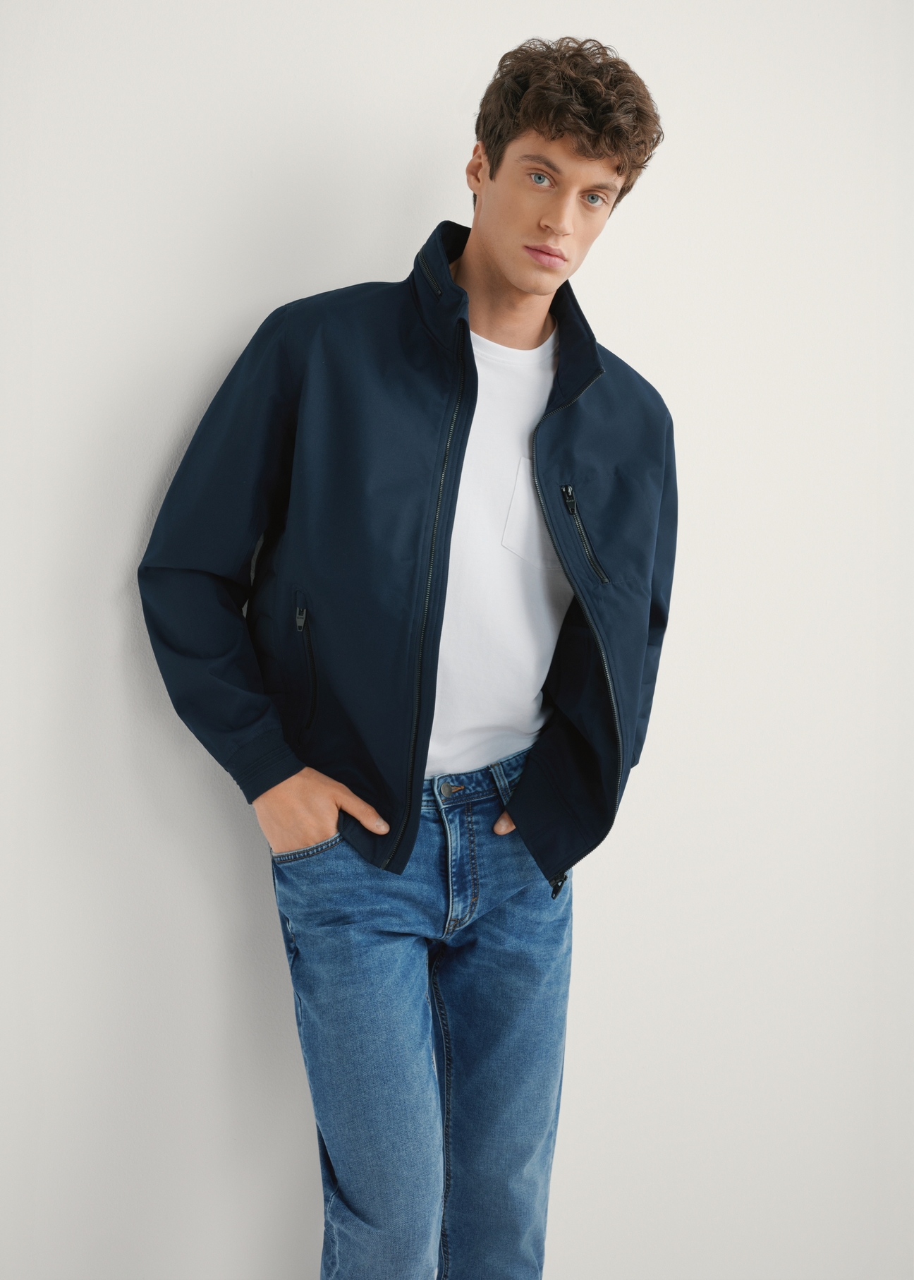 Men's navy blue transitional jacket KURMT-0414-7D(W26), front product view on model. Half silhouette visible.