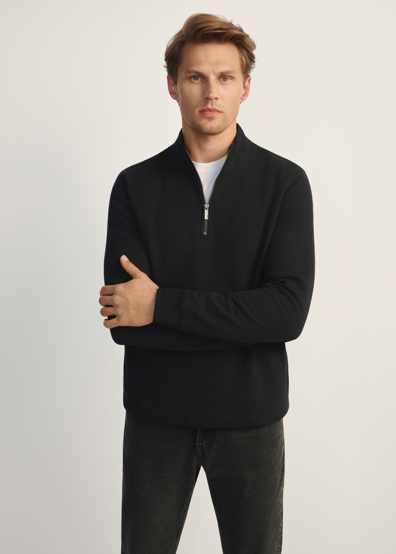 Men's black hooded sweatshirt BLZMT-0067-99(Z25), front view of the product on the model. Half of the silhouette visible.