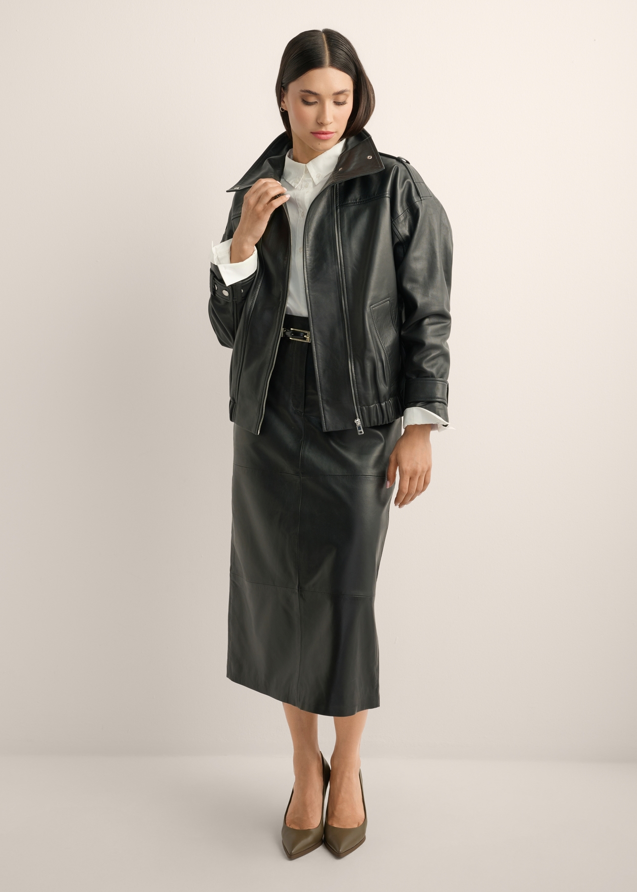 Black oversized leather jacket KURDS-0623-99(Z26), front view of the product on the model. Full body visible.