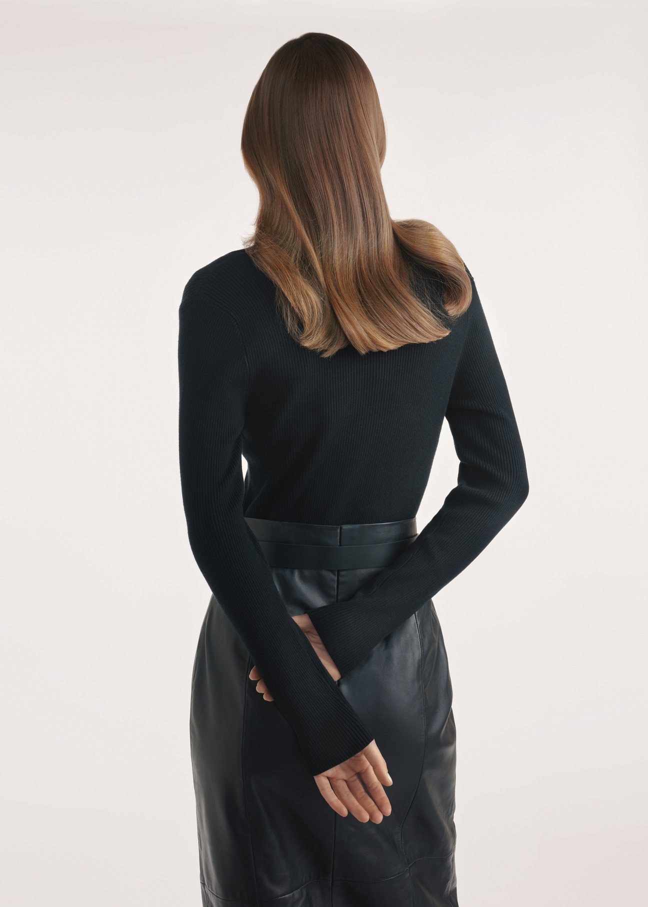 Black women's blouse LSLDT-0048-99(Z25) - product view from the back on a model on a white background. Half of the silhouette visible.
