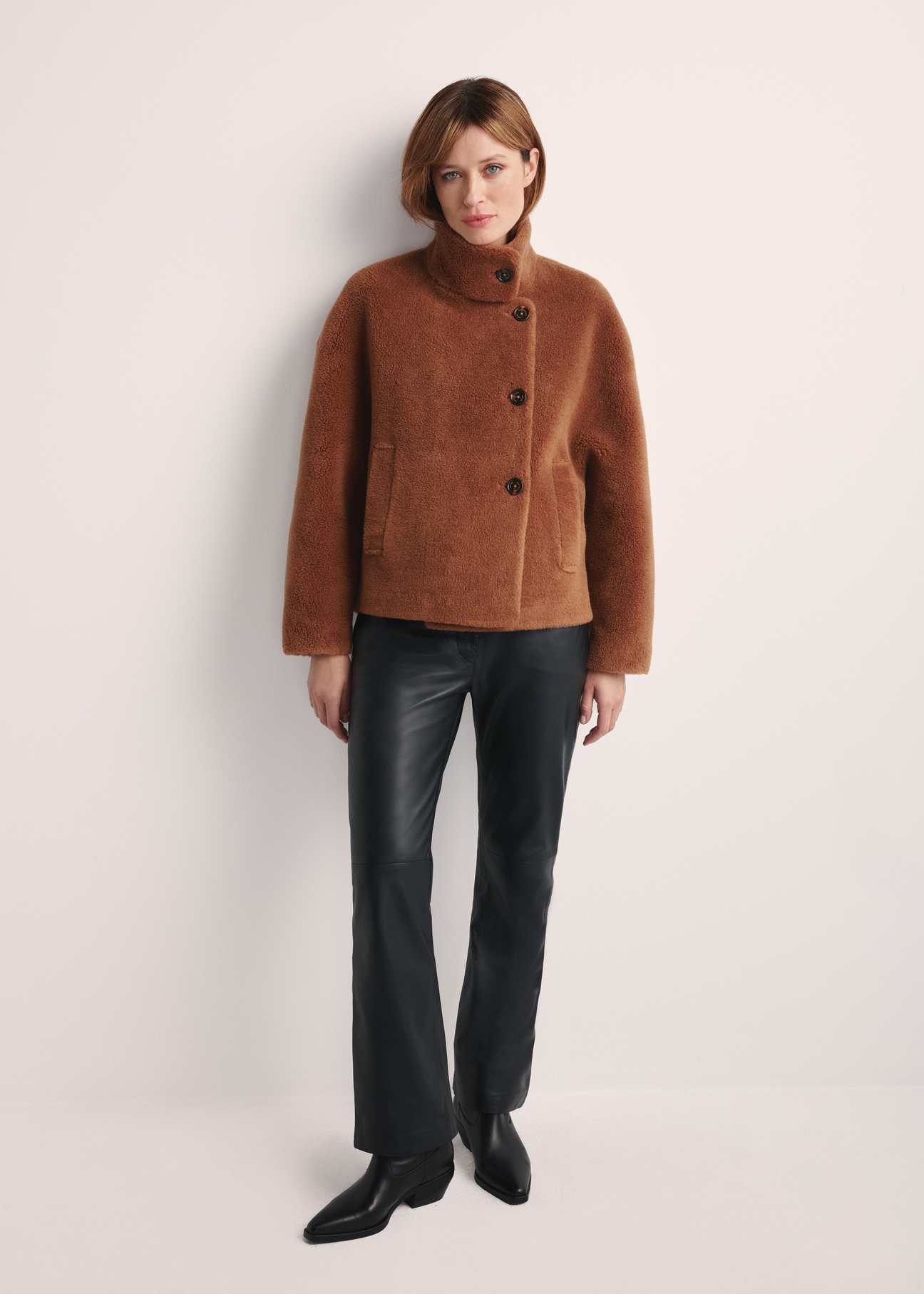 Brown women's fur coat FUTDP-0033-24(Z 25), front view of the product on the model. The entire silhouette is visible.