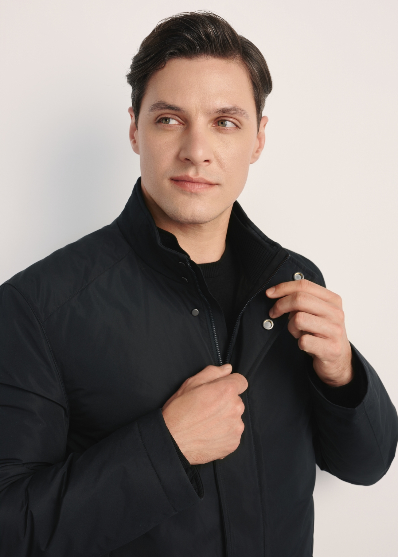 Black men's transitional jacket KURMT-0388-99(Z25), product visible from the front on the model, close-up of the sleeves.