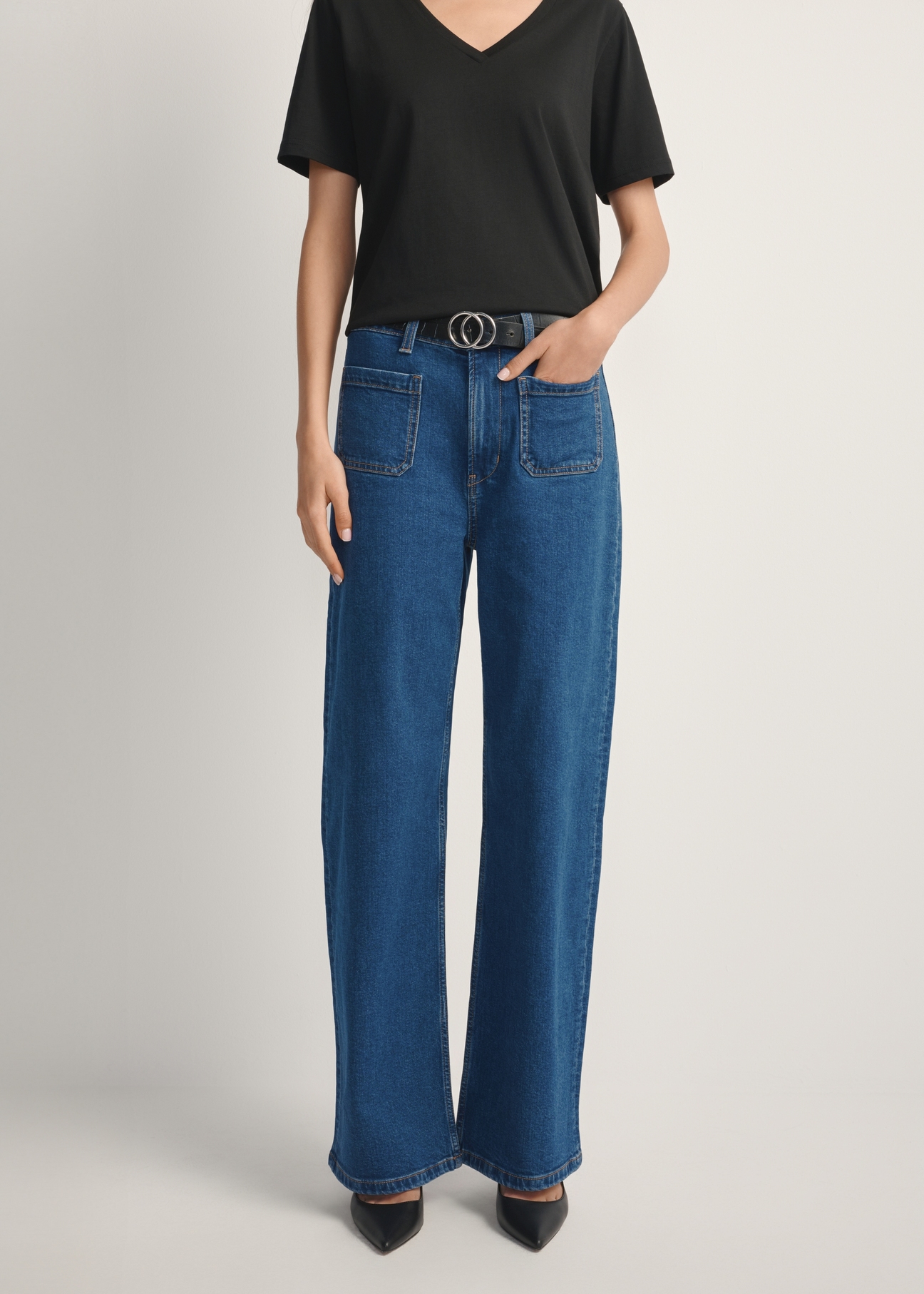 Women's blue denim pants JEADT-0014-7H(W26), front view of the product on the model. Half of the silhouette visible.