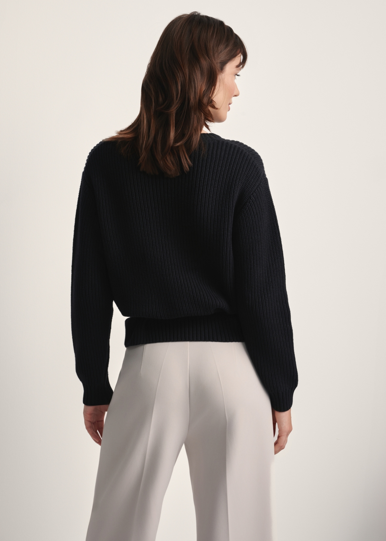 Black women's sweater SWEDT-0238-99(Z25), back view of the product on the model. Half of the silhouette visible.