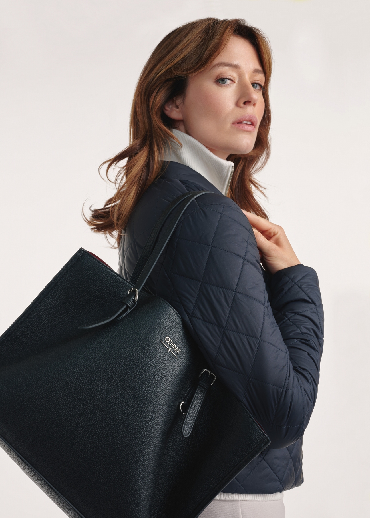 Black large shopper bag TOREC-1088-99(Z25), product view on a model, half of the silhouette visible.