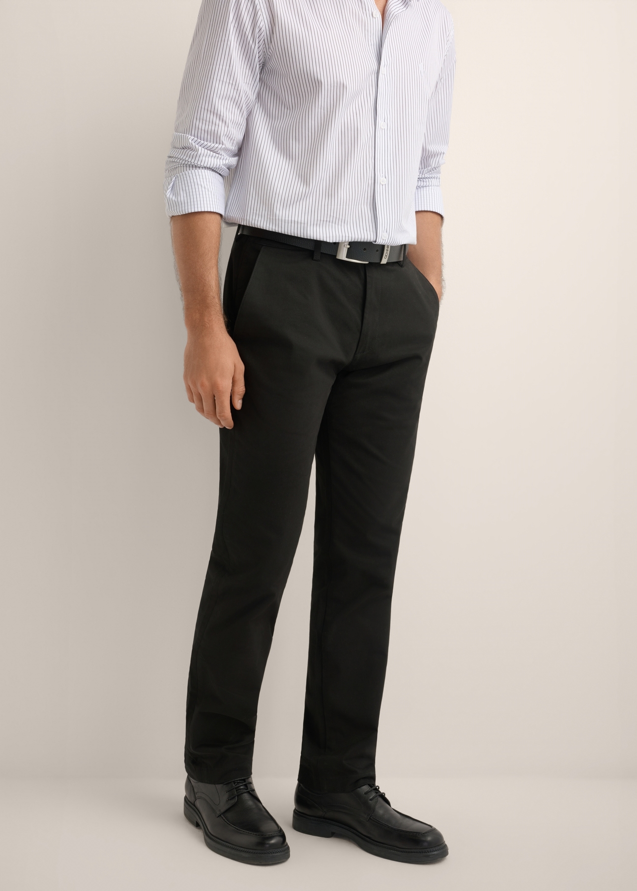 Black men's trousers SPOMT-0121-99(W26), front view of the product on the model. Half of the silhouette visible.