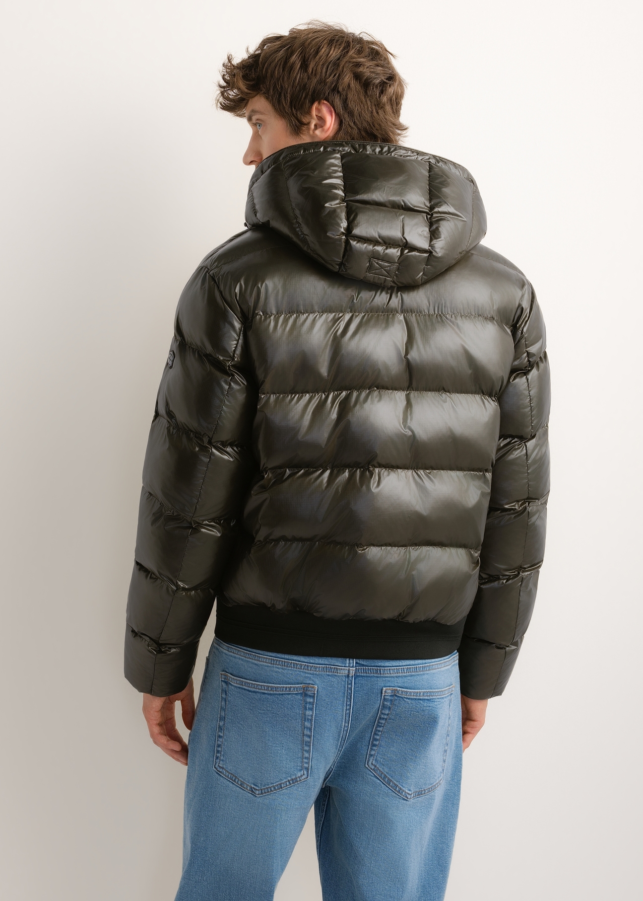 Men's green nylon jacket KURMT-0448-8B(Z26), product view from the back on the model. Half of the silhouette visible.