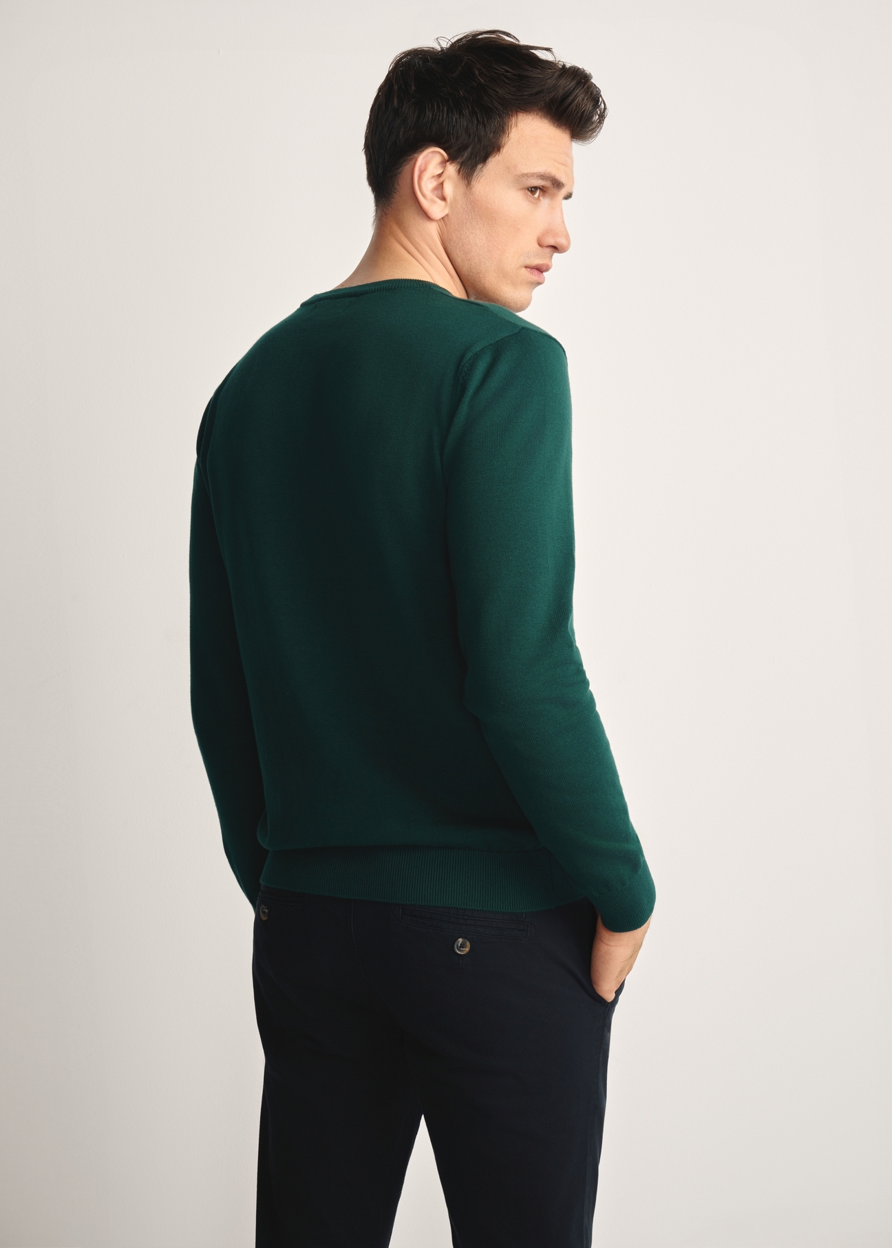 Green men's basic sweater SWEMT-0114A-54(Z25), product view from the back on the model, half of the silhouette visible.