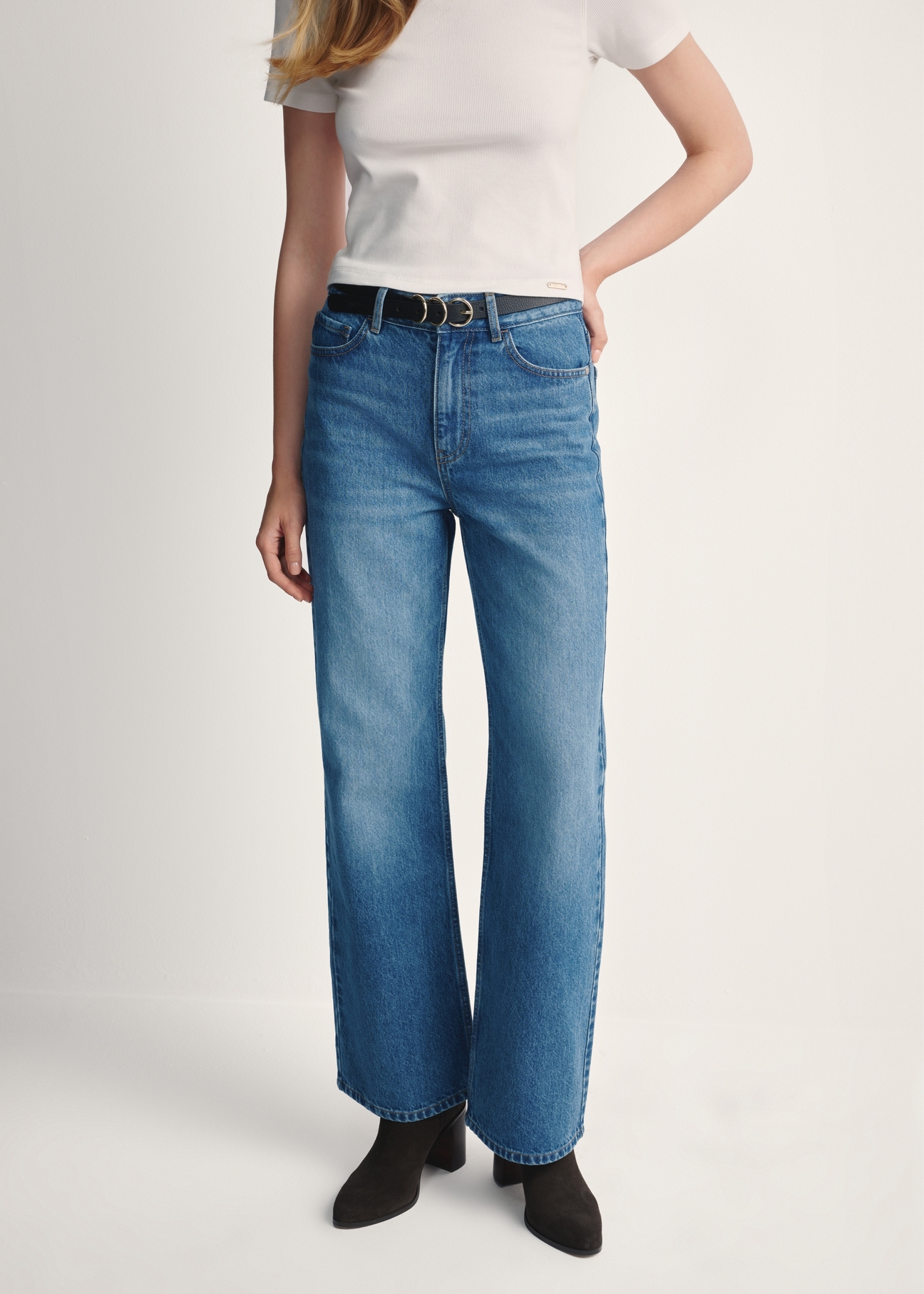 Women's blue denim pants JEADT-0012-61(Z25), front view of the product on the model. Half of the silhouette visible.