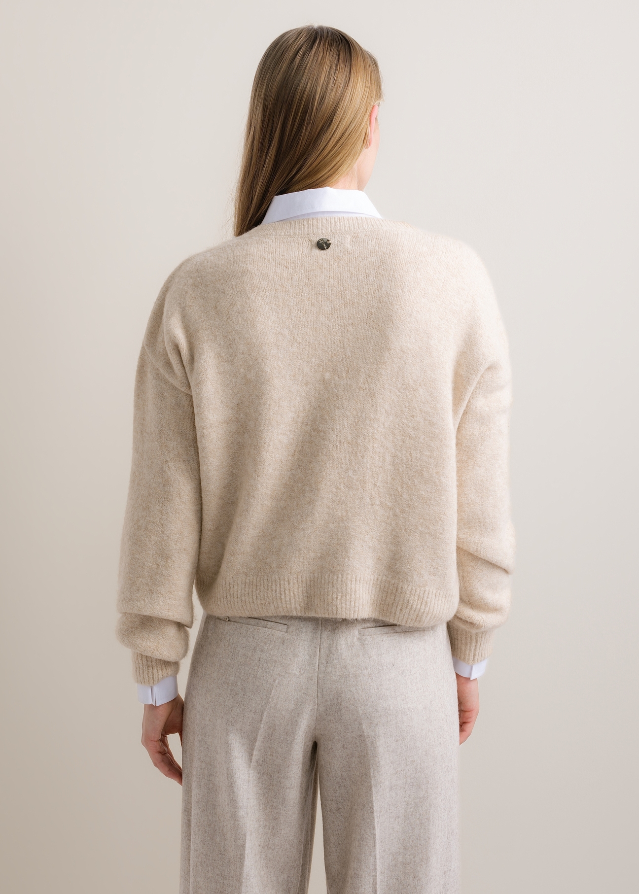 Light beige women's sweater with a wool blend (SWEDT-0271-1A(Z26)), shown from the back on a model. Half-body view.
