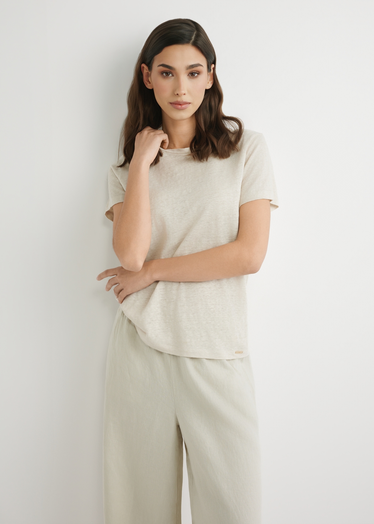 Light beige women's linen T-shirt TSHDT-0156-1A(W26), front product view, against a light background. Half of the silhouette visible.