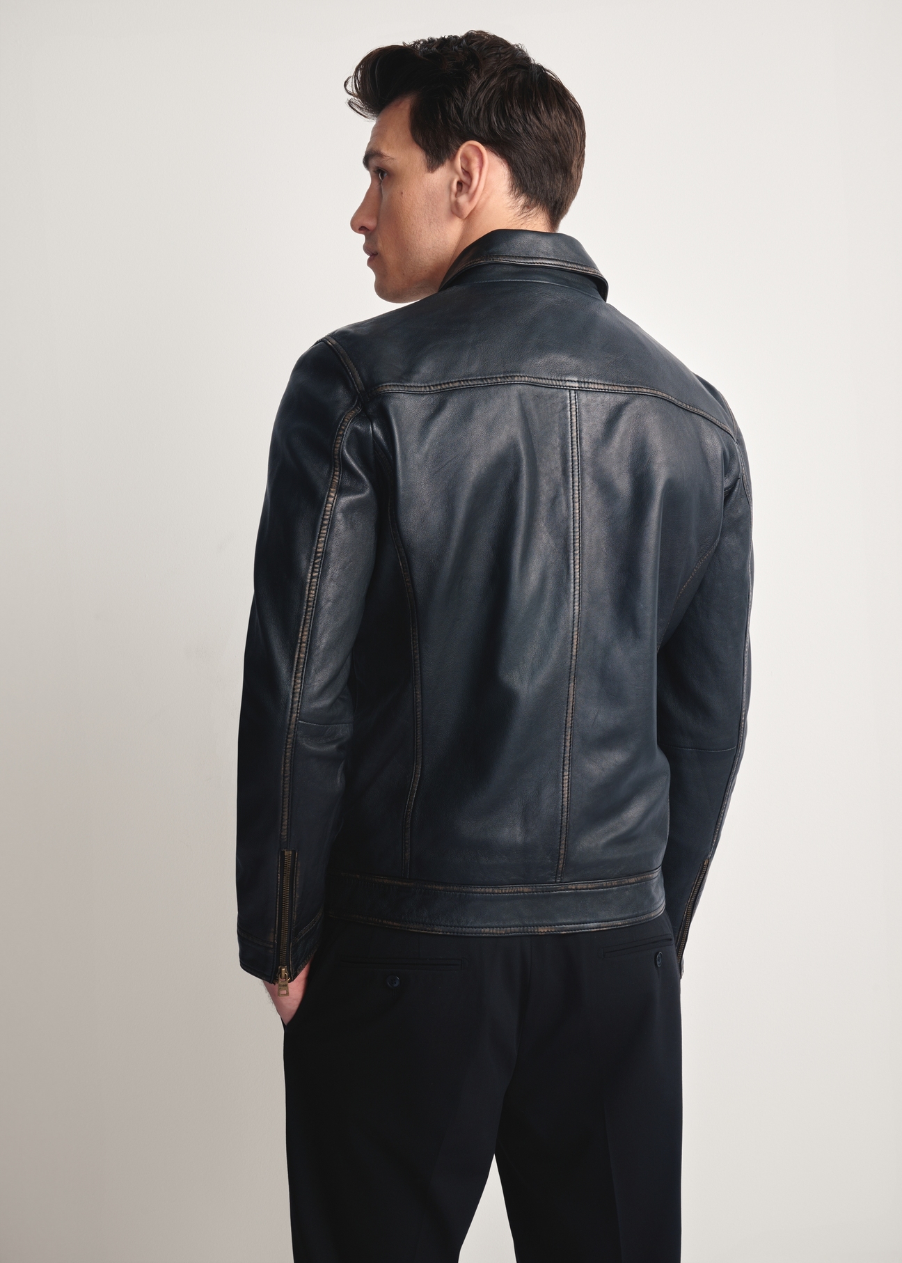 Black men's vintage leather jacket KURMS-0381-2870(Z25), product view from the back on the model, half of the silhouette visible.