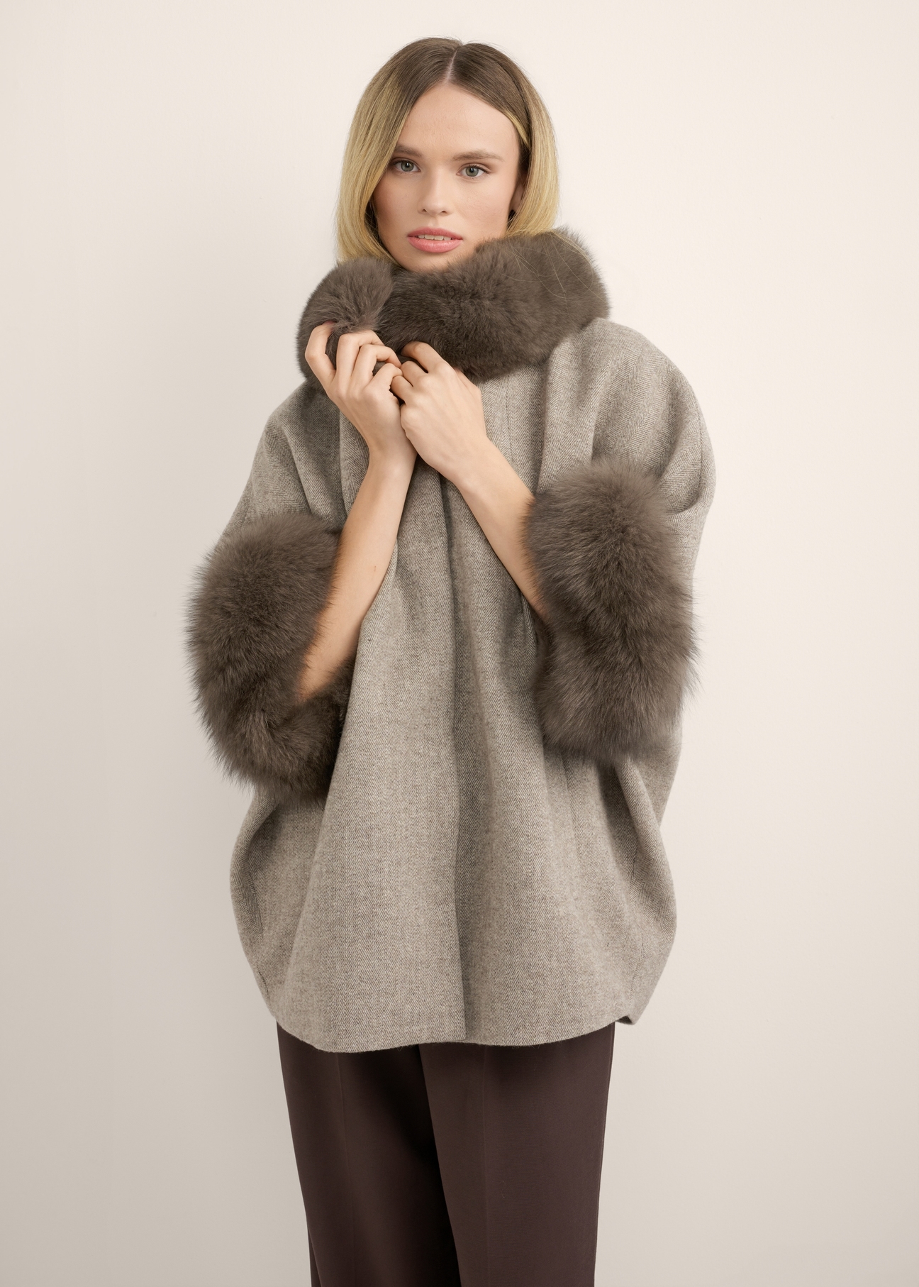 Wool vest with fur KAMDW-0002-1A(Z26), front view of the product on the model. Half of the silhouette visible.