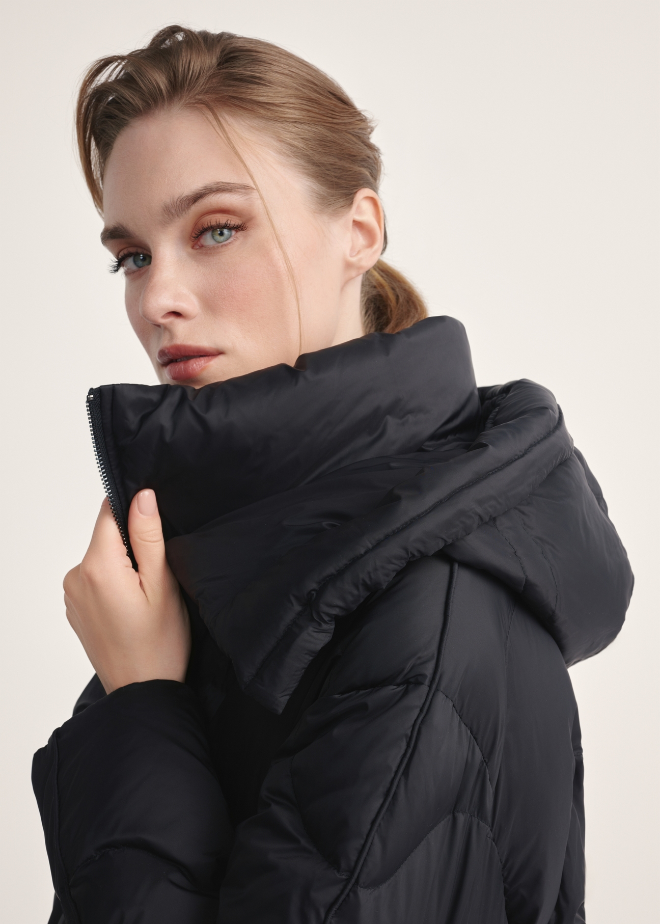 Black women's winter jacket KURDT-0604-99(Z25) - close-up of detail on model against white background.