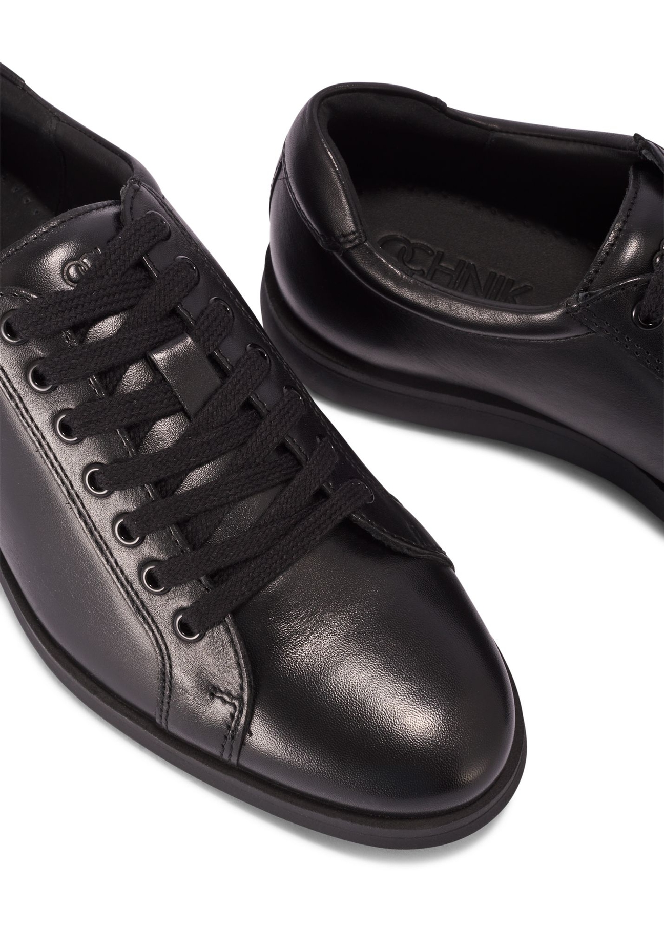 Black men's leather shoes BUTYM-0513-99(Z25) - close-up of the product from above on a white background.