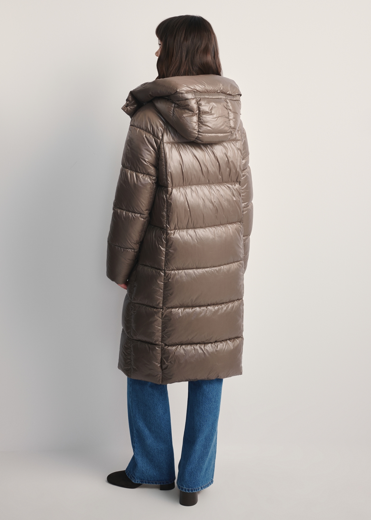 Women's long quilted jacket KURDT-0609-82(Z25), back view of the product on a model. Full body visible.