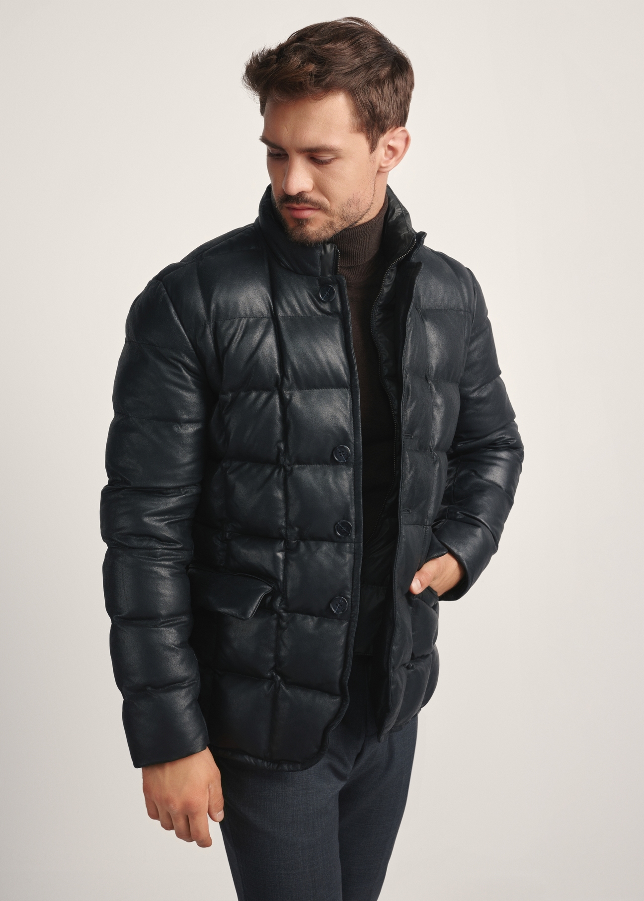 Black men's leather insulated jacket KURMS-0375-2872(Z25), front view of the product on the model, half of the silhouette visible.
