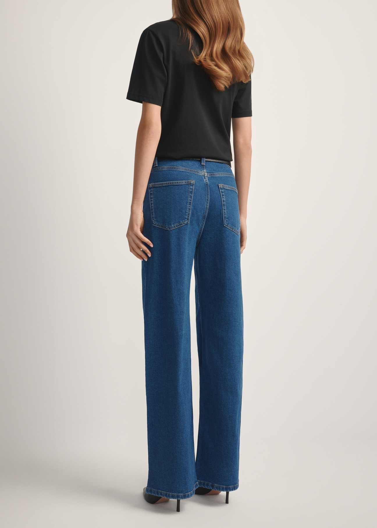 Women's blue denim pants JEADT-0014-7H(W26), back view of the product on the model. Half of the silhouette visible.