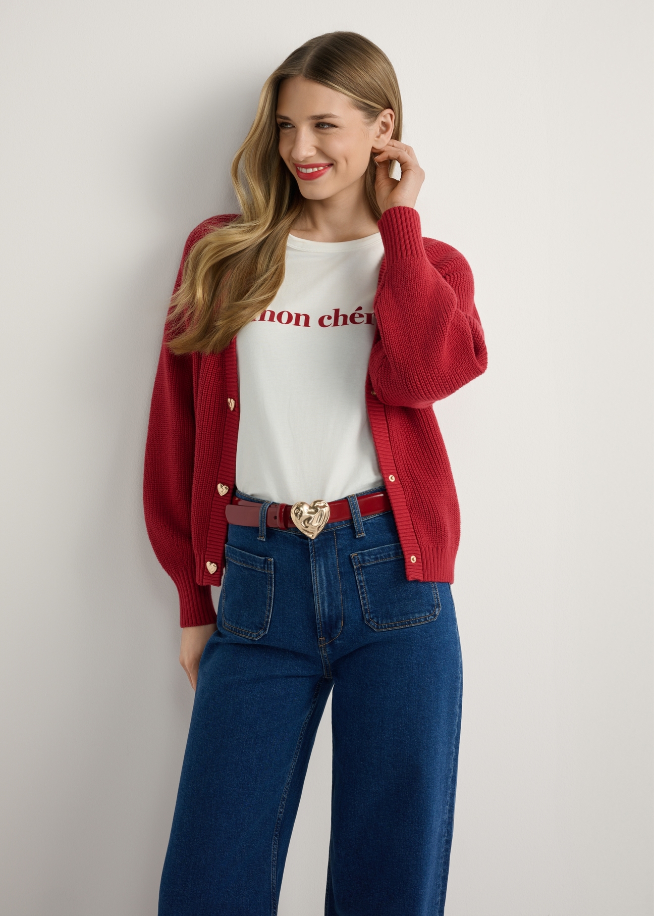 Red women's cardigan KARDT-0062-4B(W26), front view of the product on the model. Half of the silhouette visible.