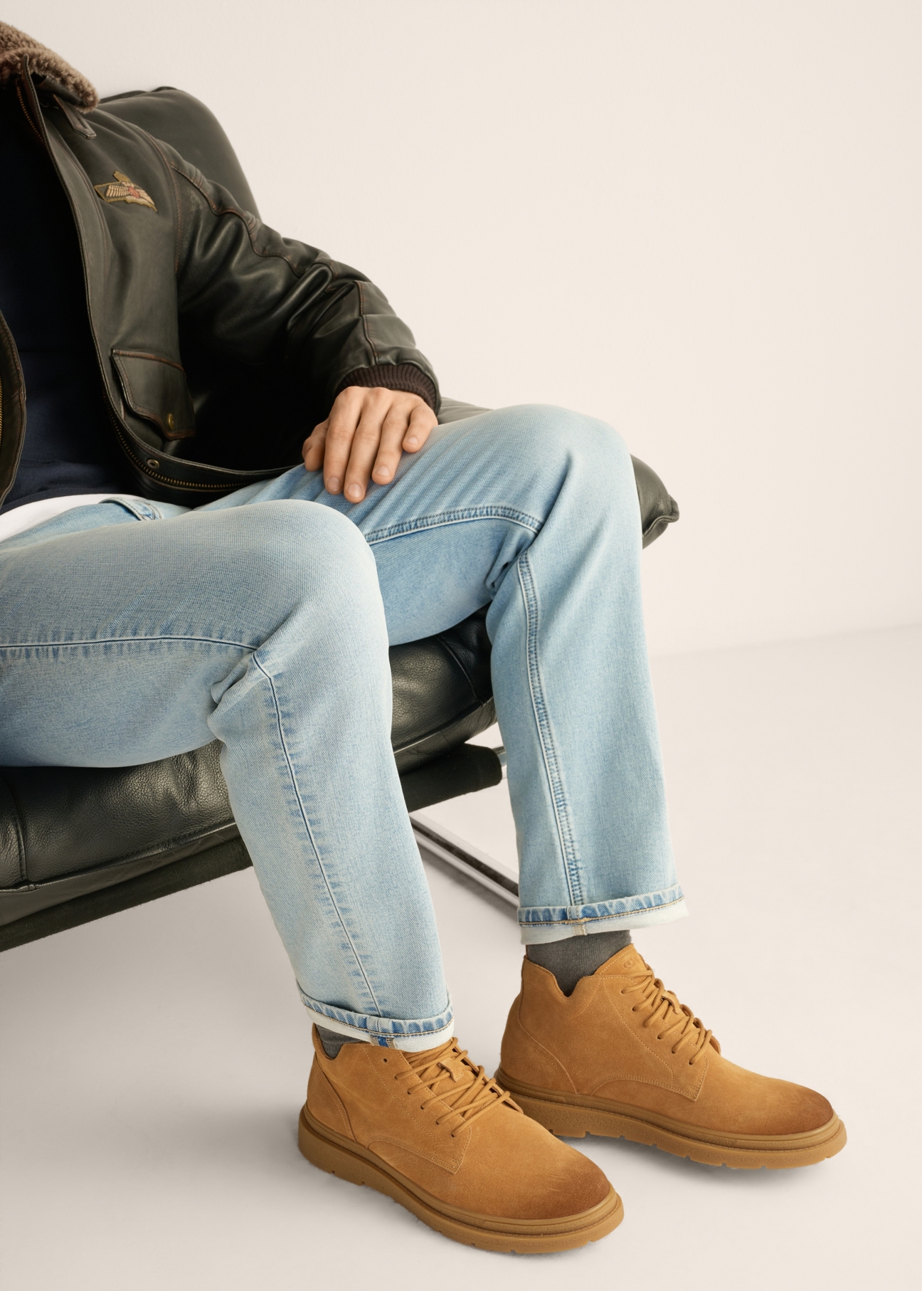 Men's cognac suede ankle boots BUTYM-0559-1F(Z26), side view of the product on the model's feet.
