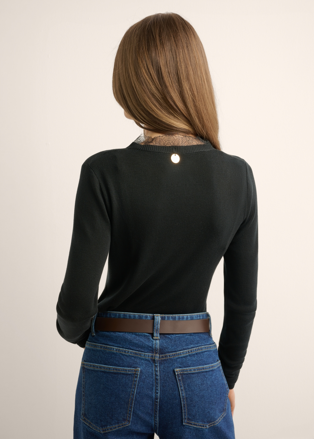 Thin black women's sweater with lace accent SWEDT-0262-99(Z26), back view of the product on the model. Half of the silhouette visible.