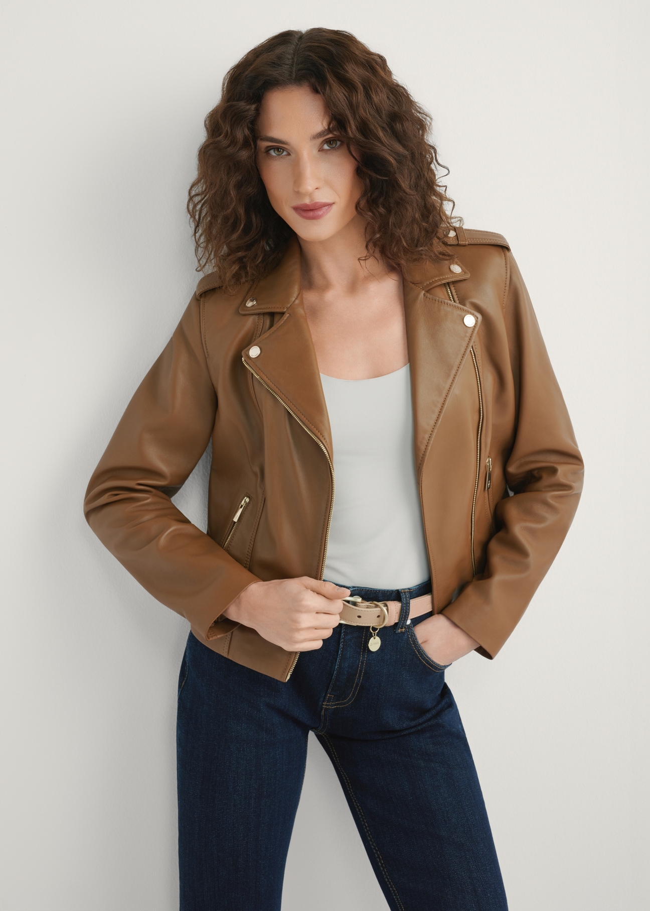 Women's beige leather jacket KURDS-0601-1B(W26), front view of the product on the model. Half of the silhouette visible.