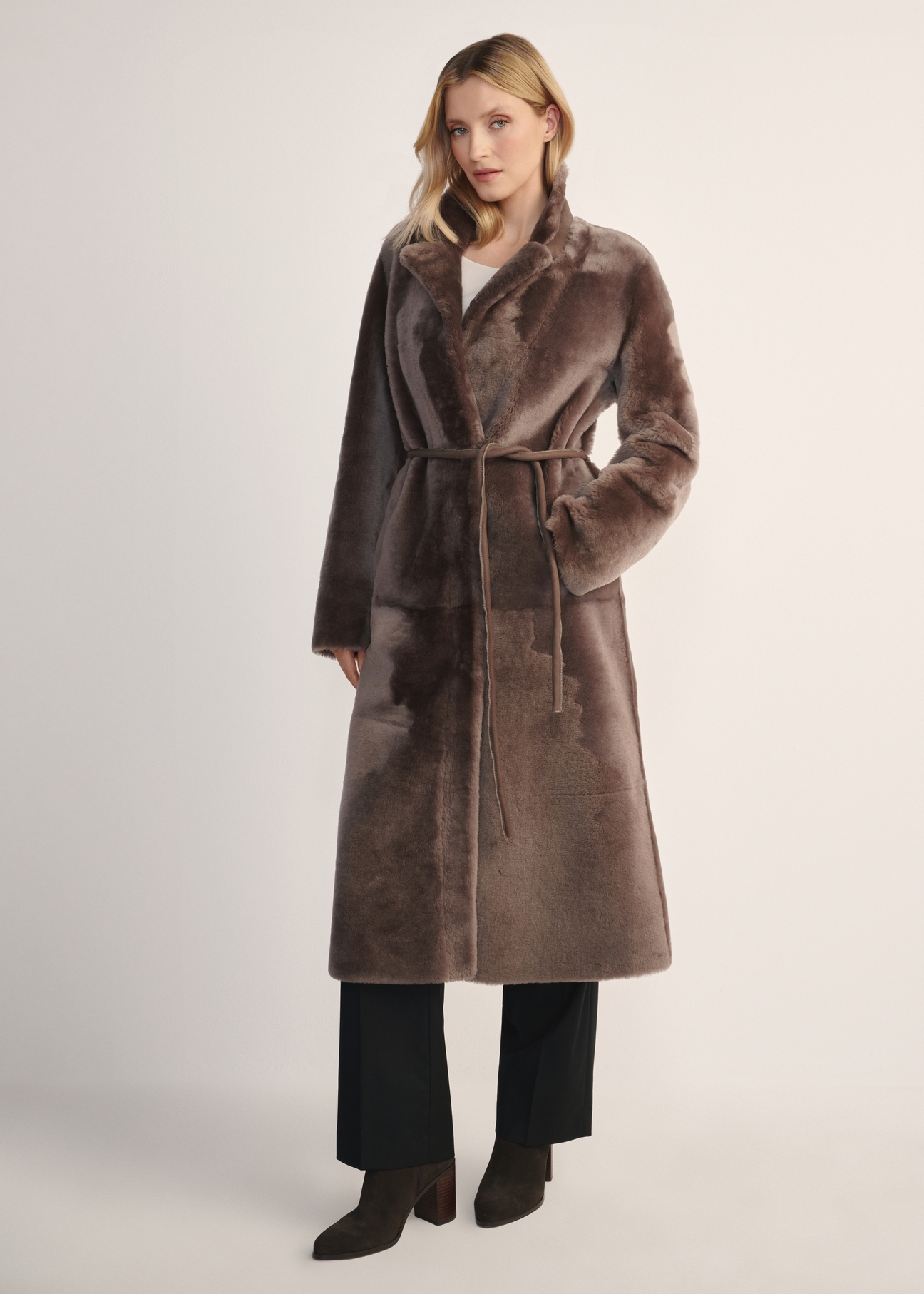Women's long brown sheepskin coat KOZDS-0086- 3094(Z25) - front view of the product on a model, against a white background. Full body visible.