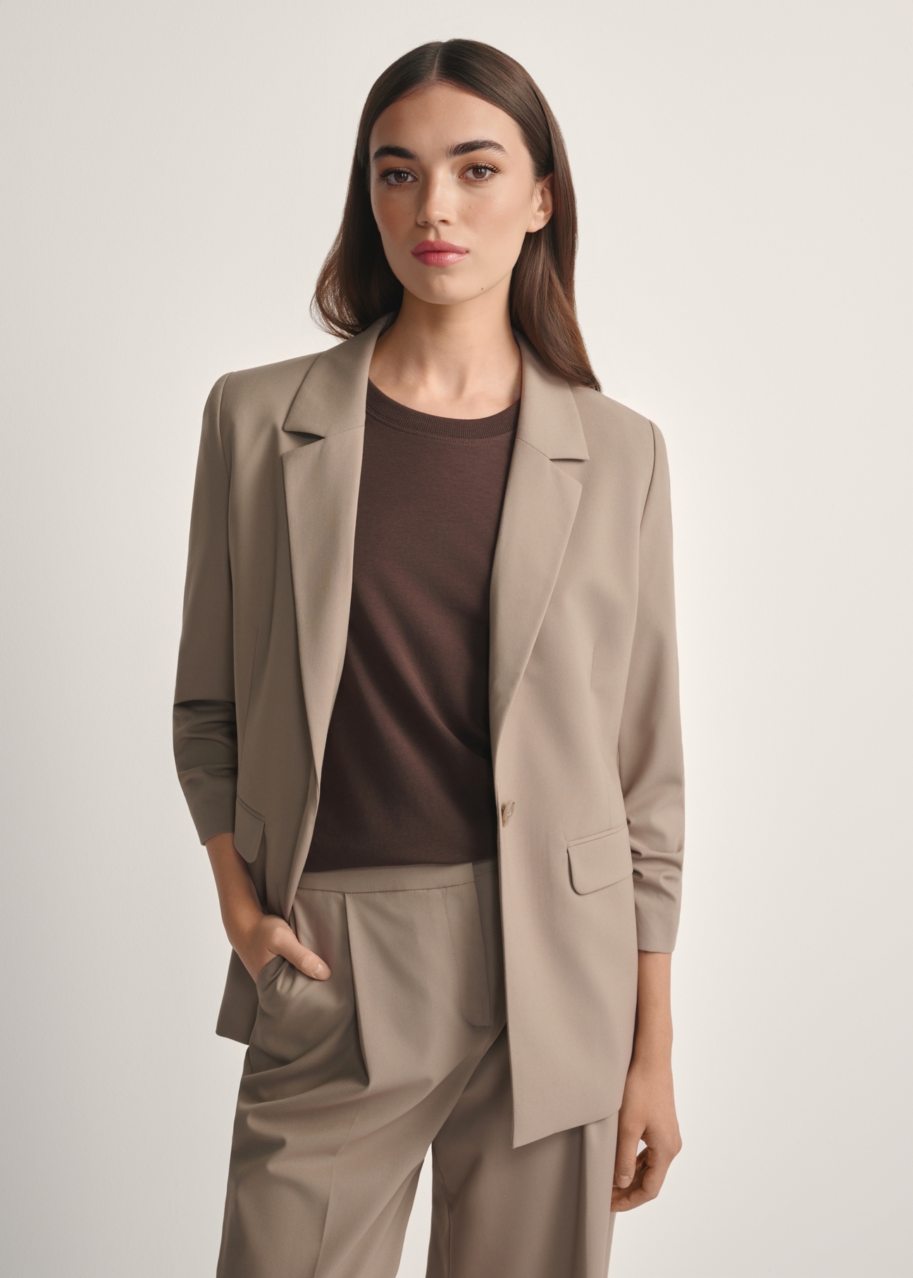 Women's dark beige jacket ZAKDT-0043-1K(W26), product view from the front on the model, half of the silhouette visible.