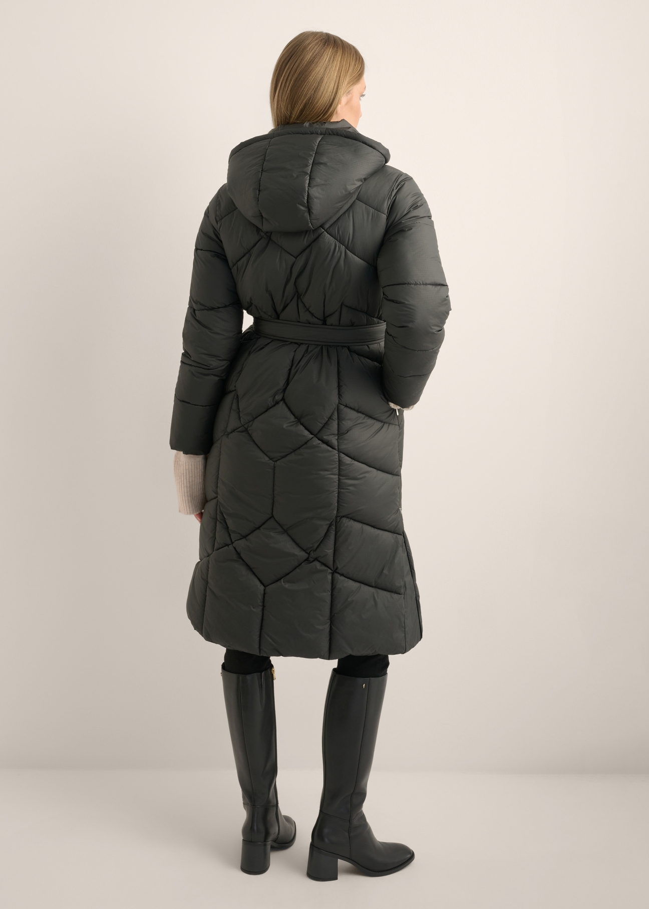 Long black women's jacket KURDT-0701-99(Z26), back view of the product on a model. Full body visible.