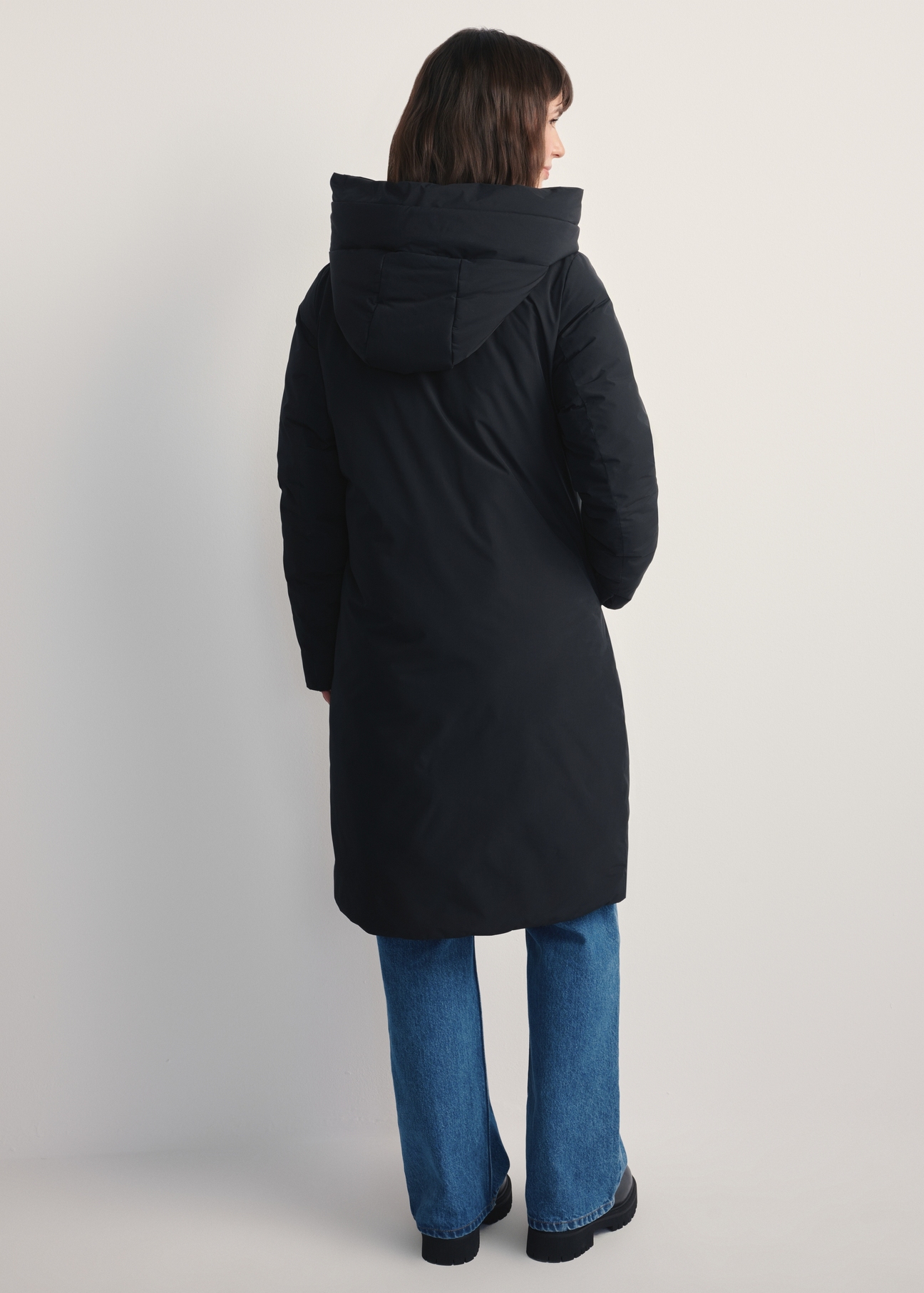 Black women's winter jacket KURDT-0583-99(Z25), product view from the back on a model. Full body visible.