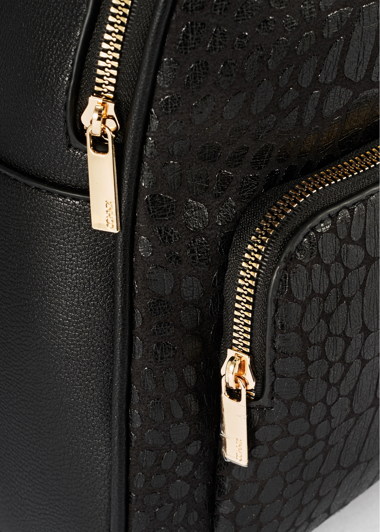 Black women's croco-style backpack TOREC-0725A-97(Z25), close-up of product detail, view on white background.-02