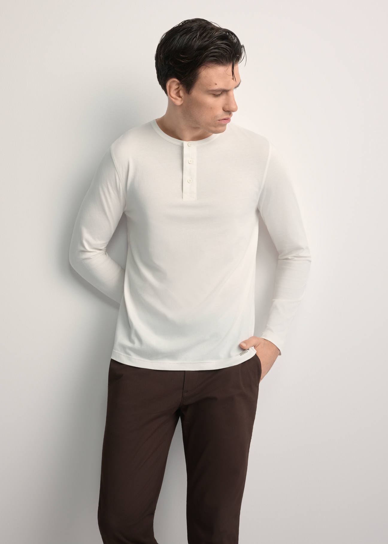 Men's white cotton longsleeve LSLMT-0010-0B(W26), front view of the product on the model. Half of the silhouette visible.