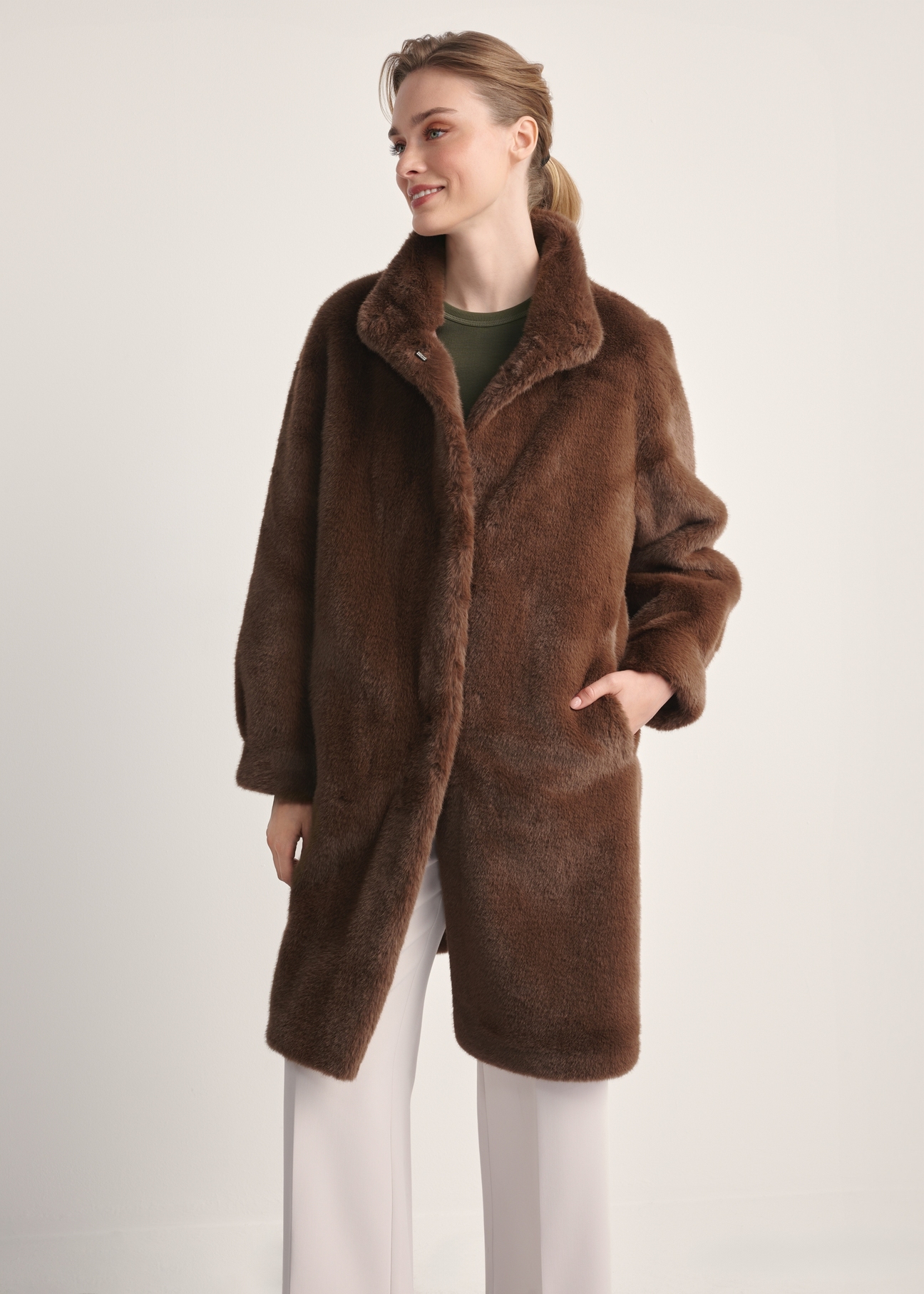 Elegant brown women's fur coat FUTDP-0050-89(Z25), product view from the front on the model, half of the silhouette visible.