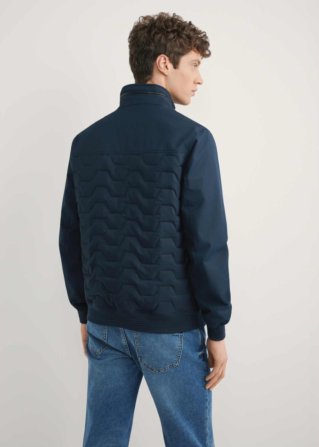 Men's navy transitional jacket KURMT-0414-7D(W26), product view from the back on the model. Half of the silhouette visible.