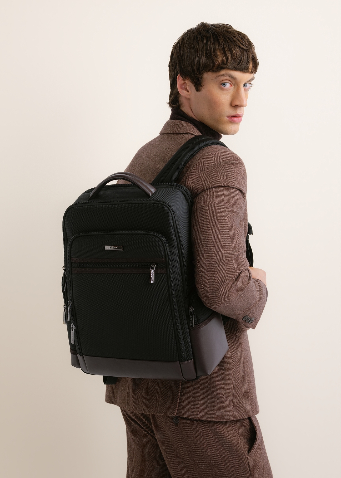 Black large men's backpack TORMN-0435-9J(Z26), product view diagonally on the model. Half of the silhouette visible.