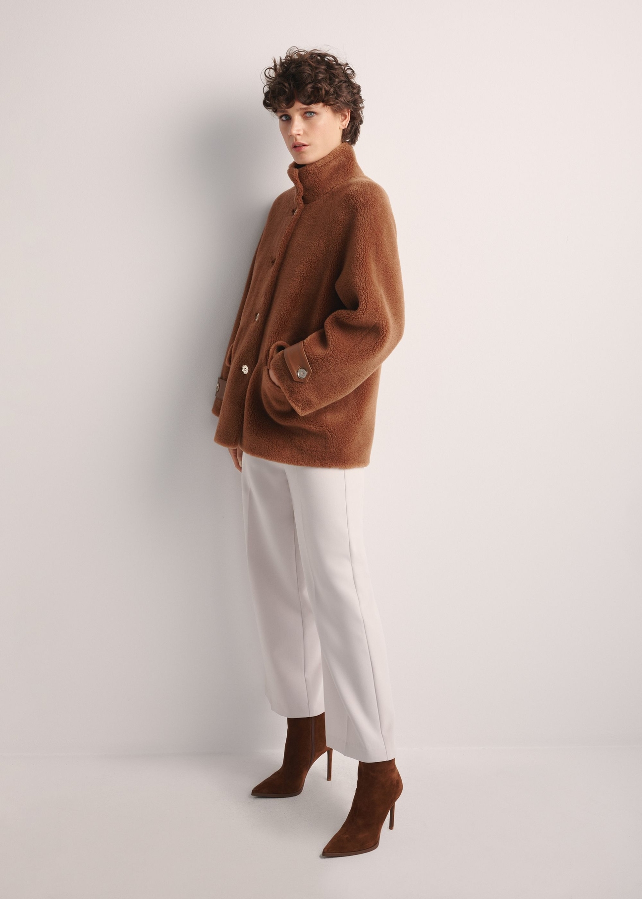 Women's woolen fur coat in camel color FUTDW-0032-24(Z25) - side view of the product on a model on a white background. The entire silhouette is visible.