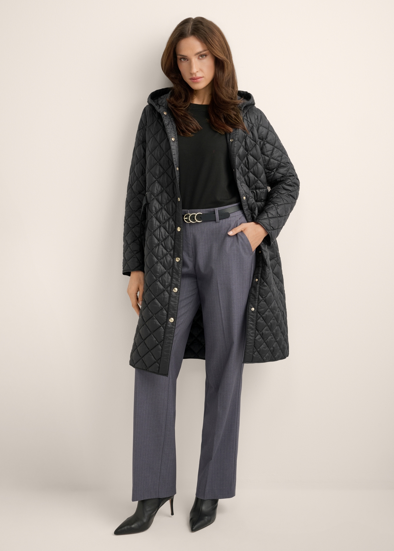 Women's black quilted jacket KURDT-0680-99(Z26), front view of the product on the model. Full body visible.