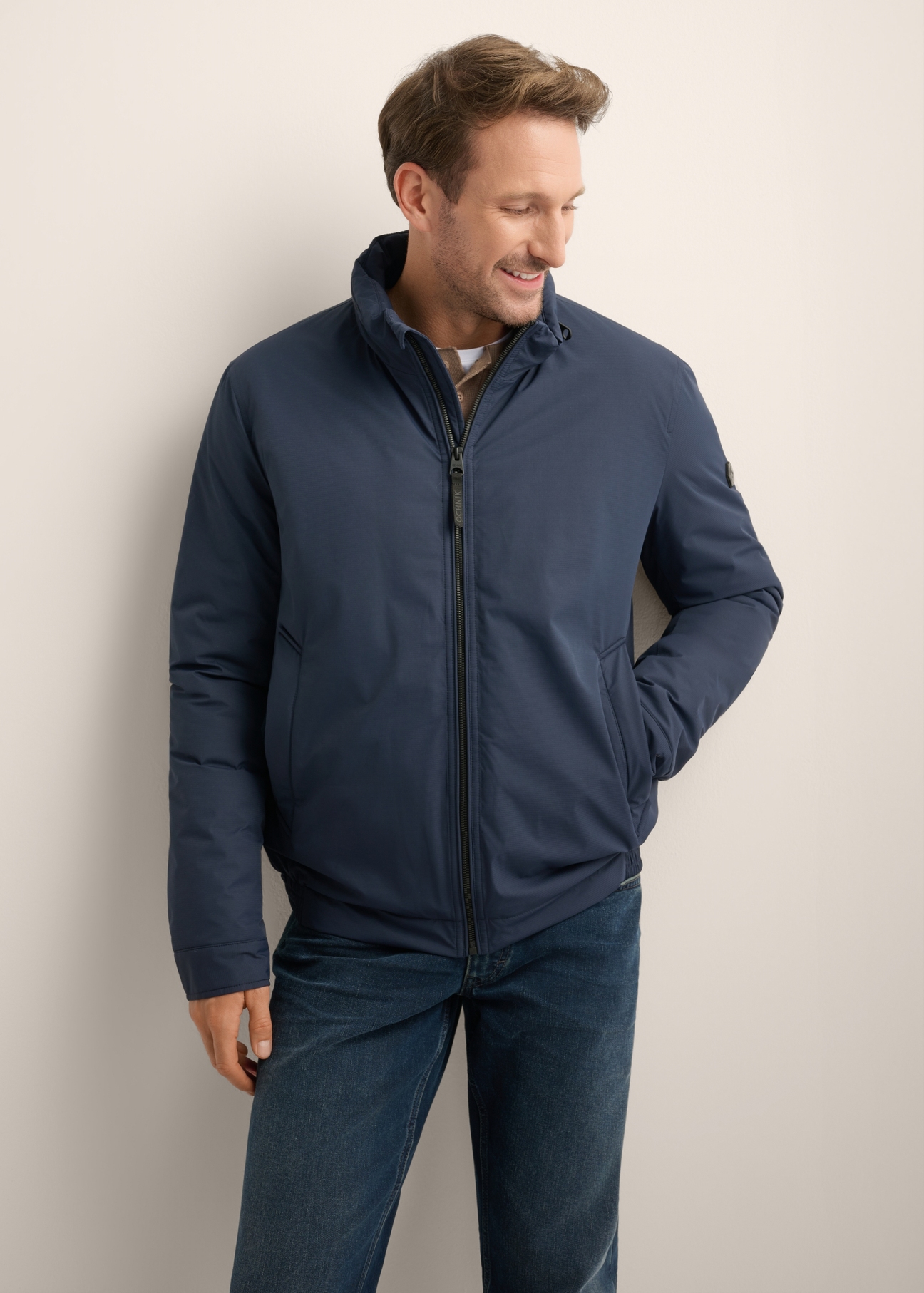 Men's navy blue transitional jacket KURMT-0423-7E(Z26), front product view on model. Half silhouette visible.