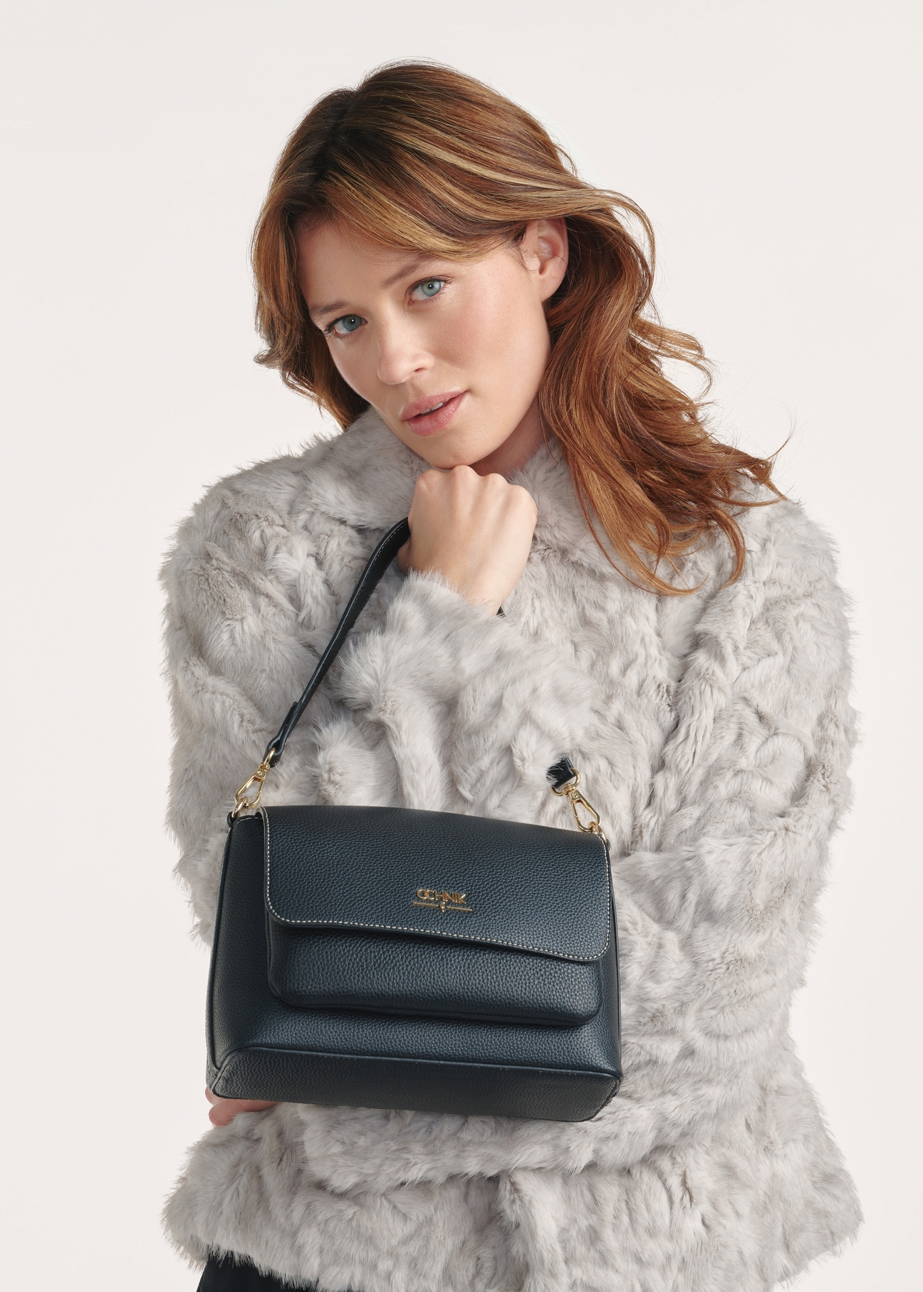 Black women's shoulder bag TOREC-1063-99(Z25), product view on the model, half of the silhouette visible.-02