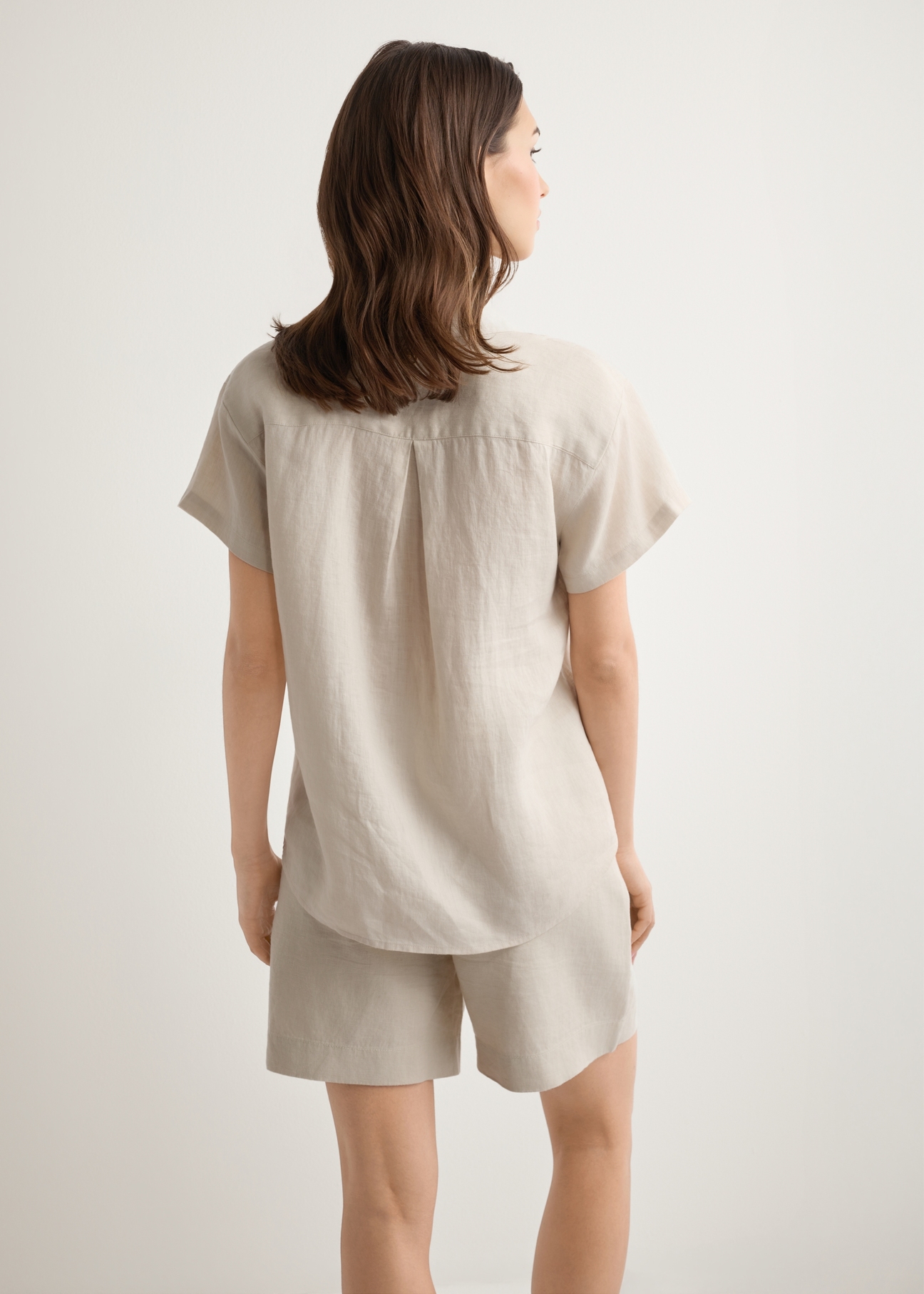 Beige women's linen shirt KOSDT-0187-1A(W26), back view of the product on the model. Half of the silhouette visible.