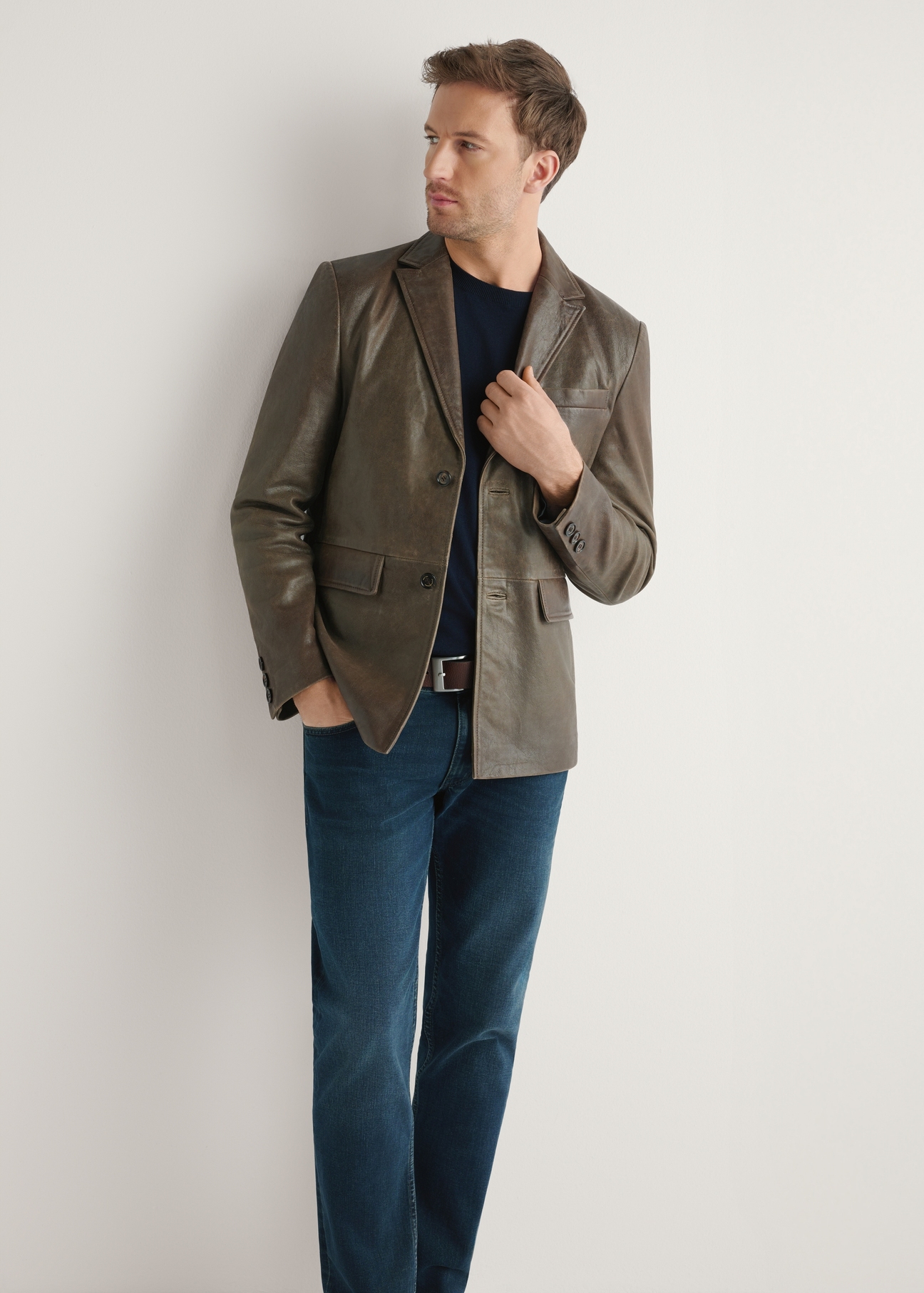 Men's brown leather jacket KURMS-0402-1H(W26) - front view of the product, on a model, against a light background. Full silhouette visible.