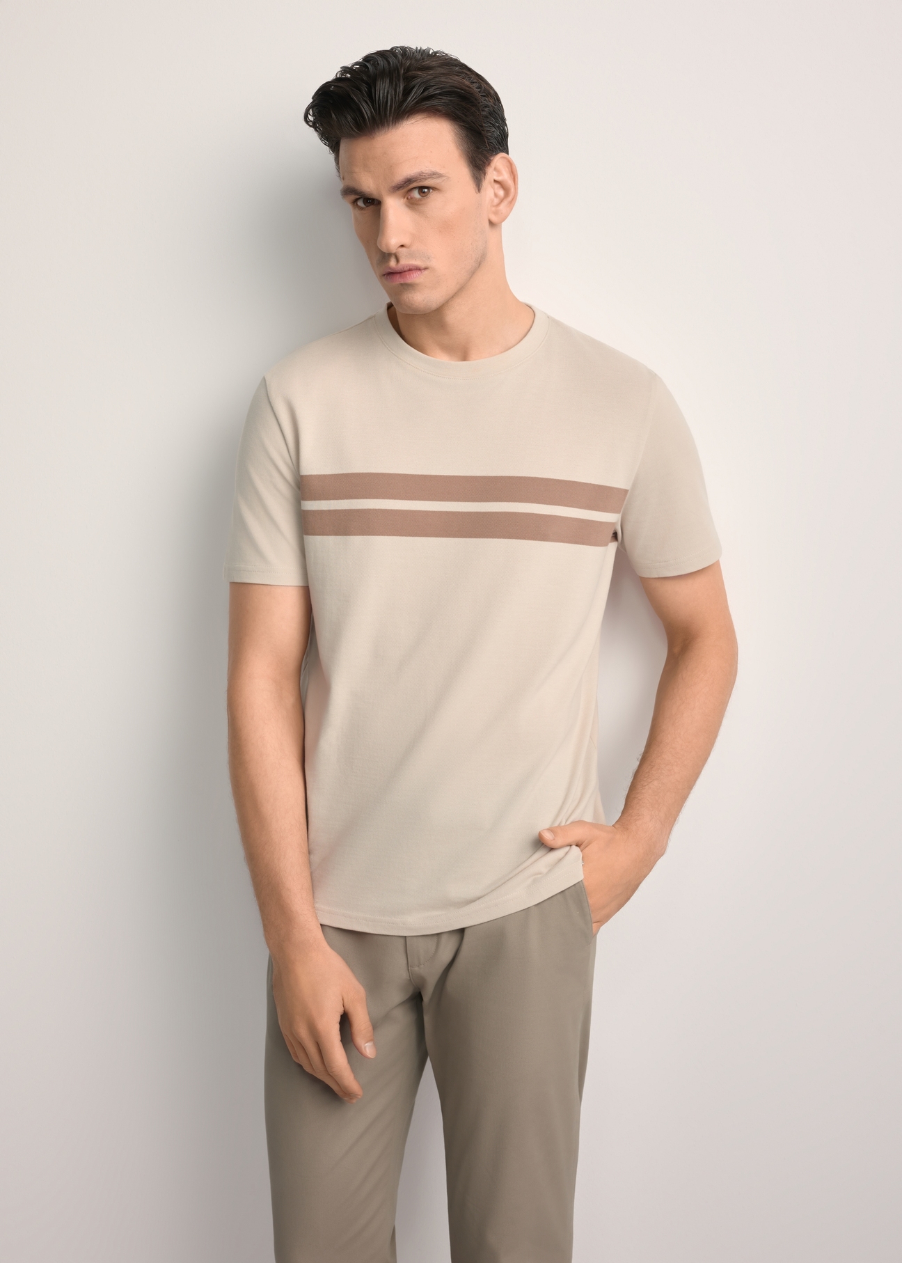 Men's beige cotton t-shirt TSHMT-0129-80(Z25) - front view of the product, on a model, against a white background. Knee-length silhouette visible.