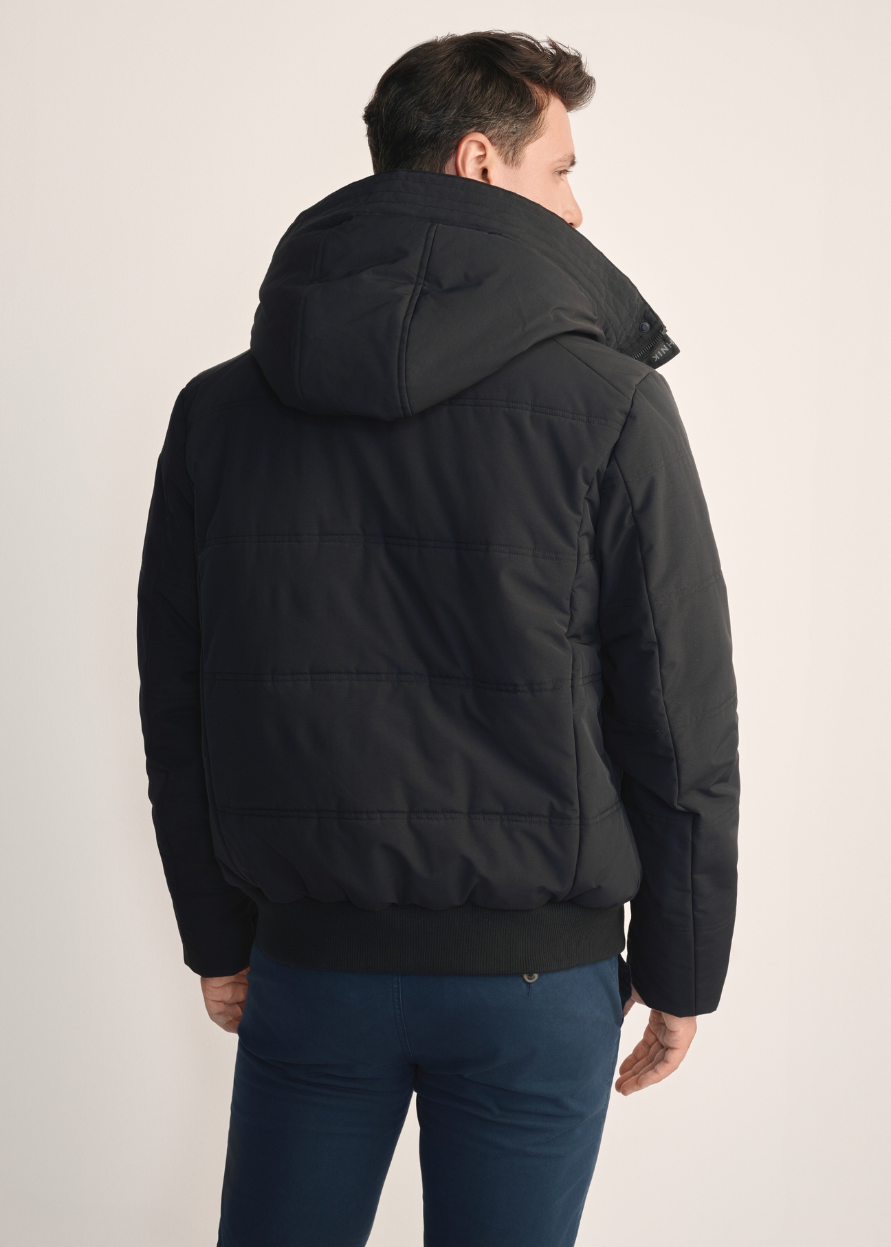 Black men's winter jacket KURMT-0273-99(Z25) - product view from the back on the model, on a white background.