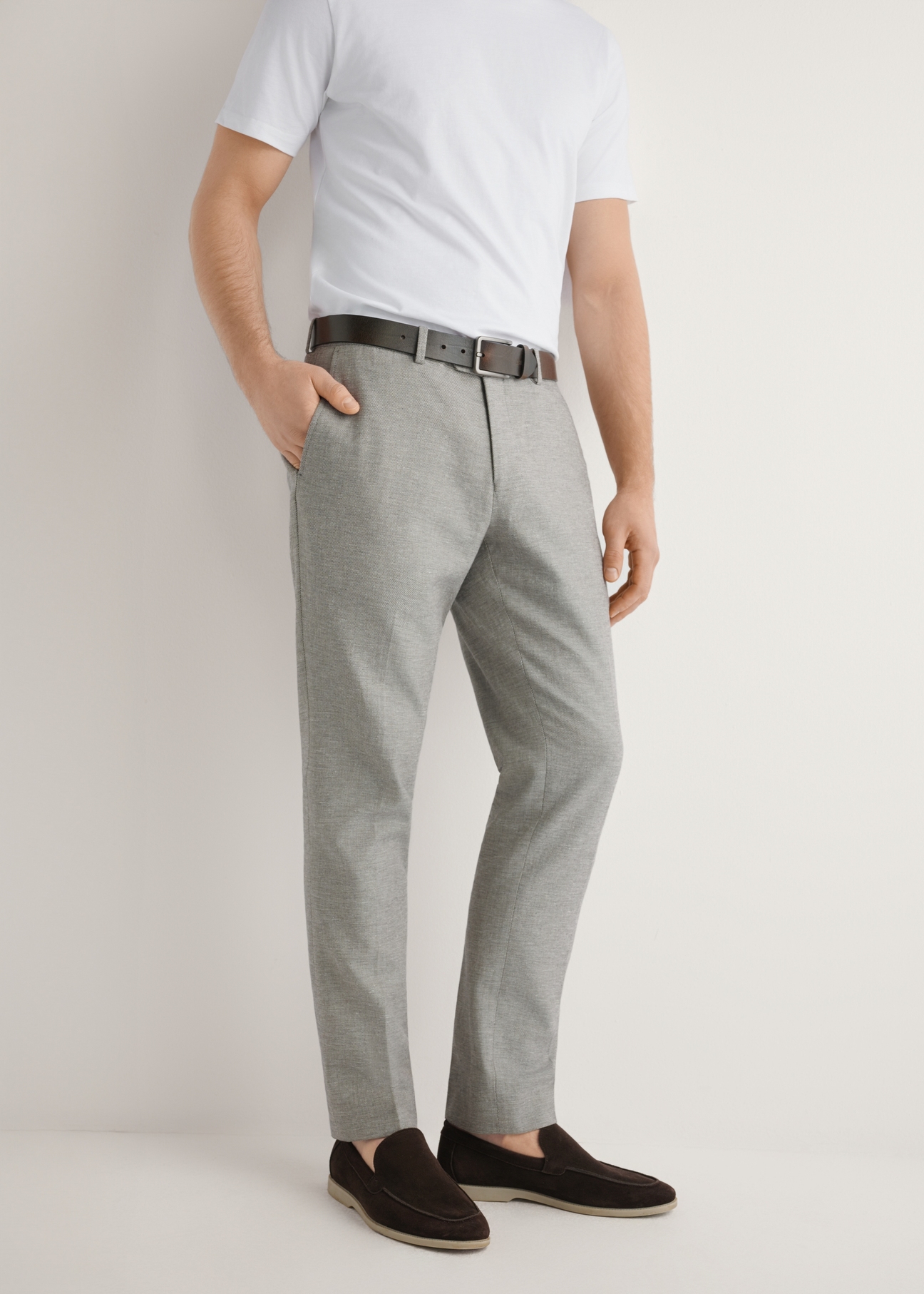 Men's beige suit trousers SPOMT-0098-1B(W26), front view of the product on the model. Half of the silhouette visible.