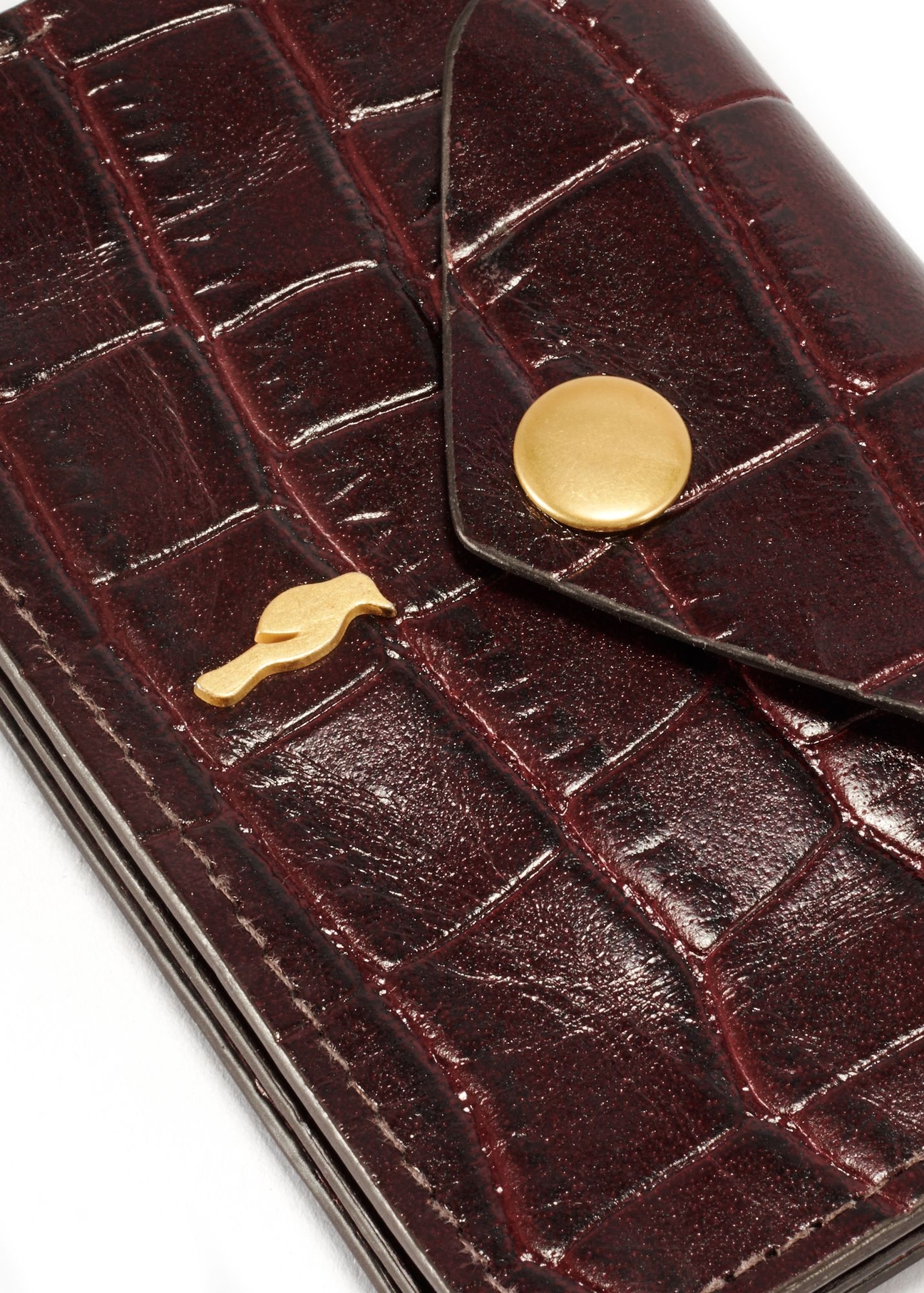 Small burgundy leather women's wallet PORES-0890B-49(Z25) - close-up detail on white background.
