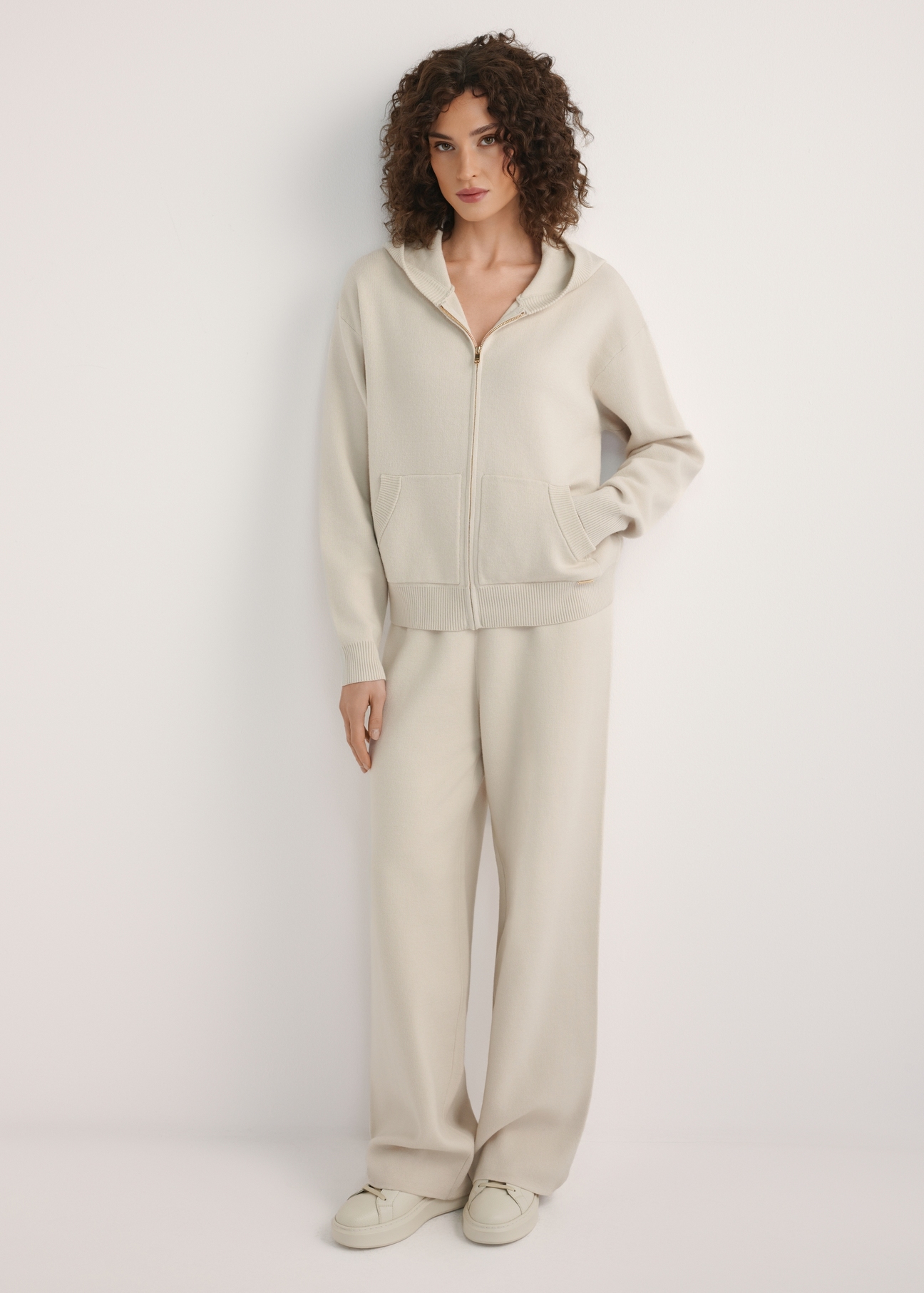 Beige women's wide leg trousers SPODT-0121-1A(W26), front view of the product on the model. Full body visible.